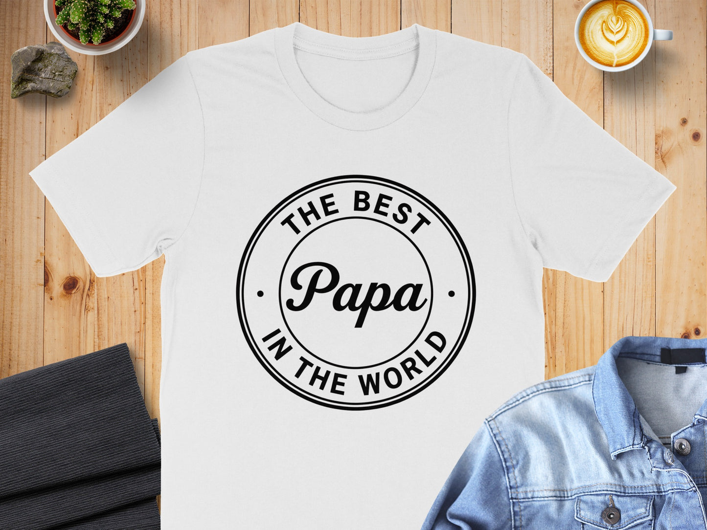 White t-shirt with "The Best Papa In The World" text in a circle.