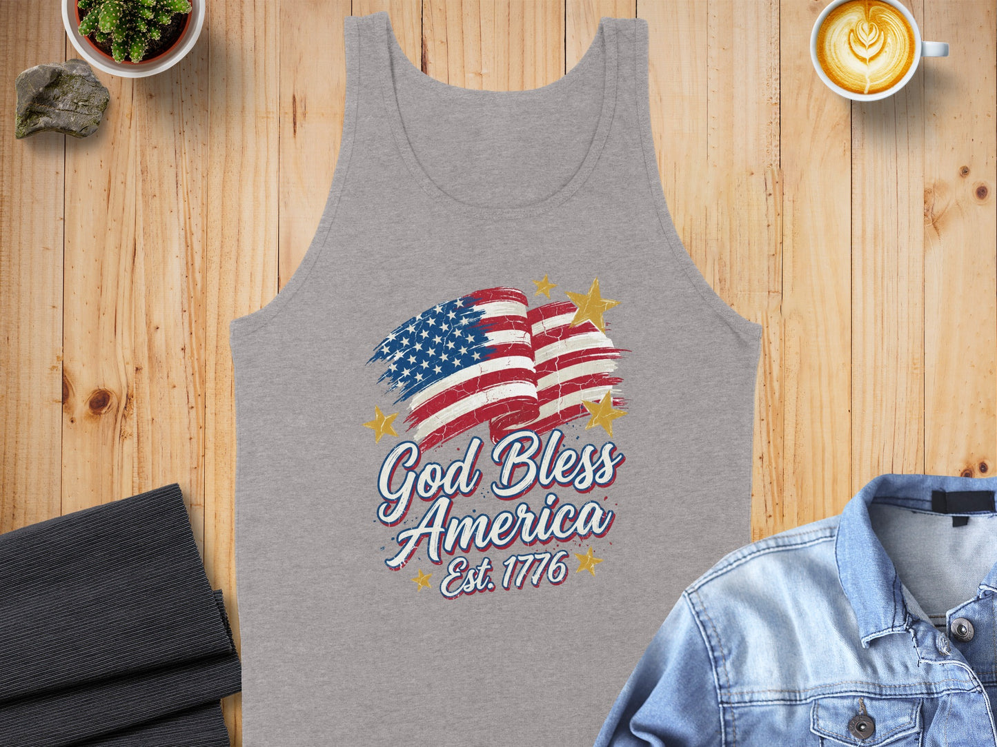 Grey tank top with "God Bless America Est. 1776" and American flag graphic.