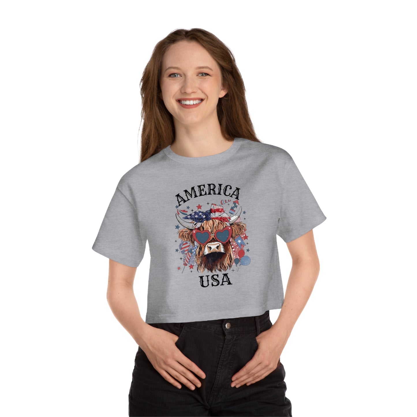 Cropped grey t-shirt with "AMERICA USA" and a Highland cow with American flag accents and heart sunglasses.