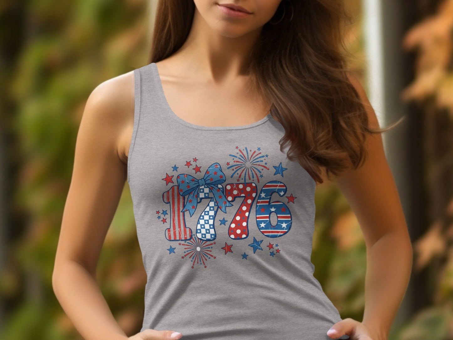 "1776" graphic on a grey tank top with stars and fireworks.