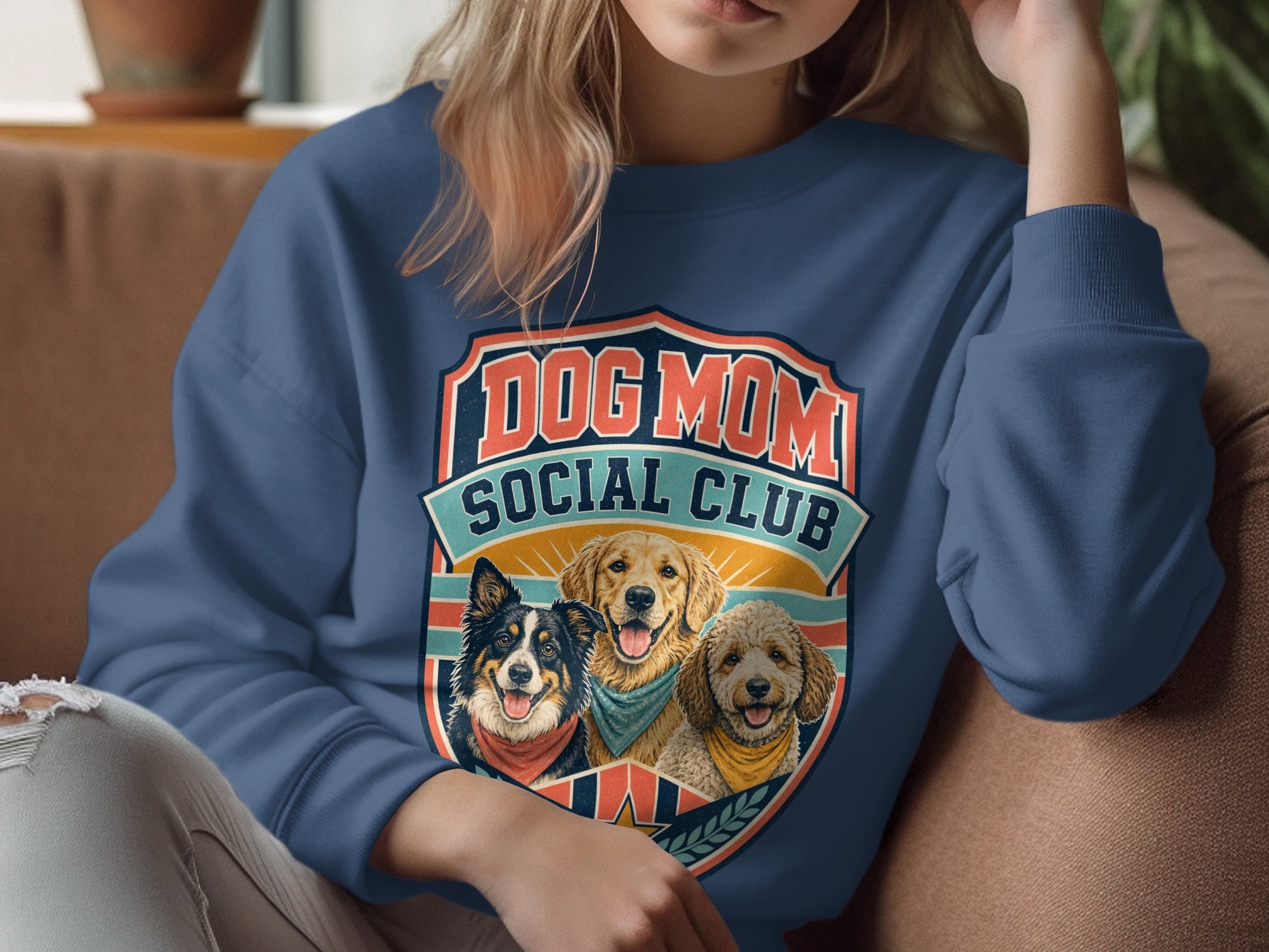 Sweatshirt with "Dog Mom Social Club" graphic featuring three dogs.