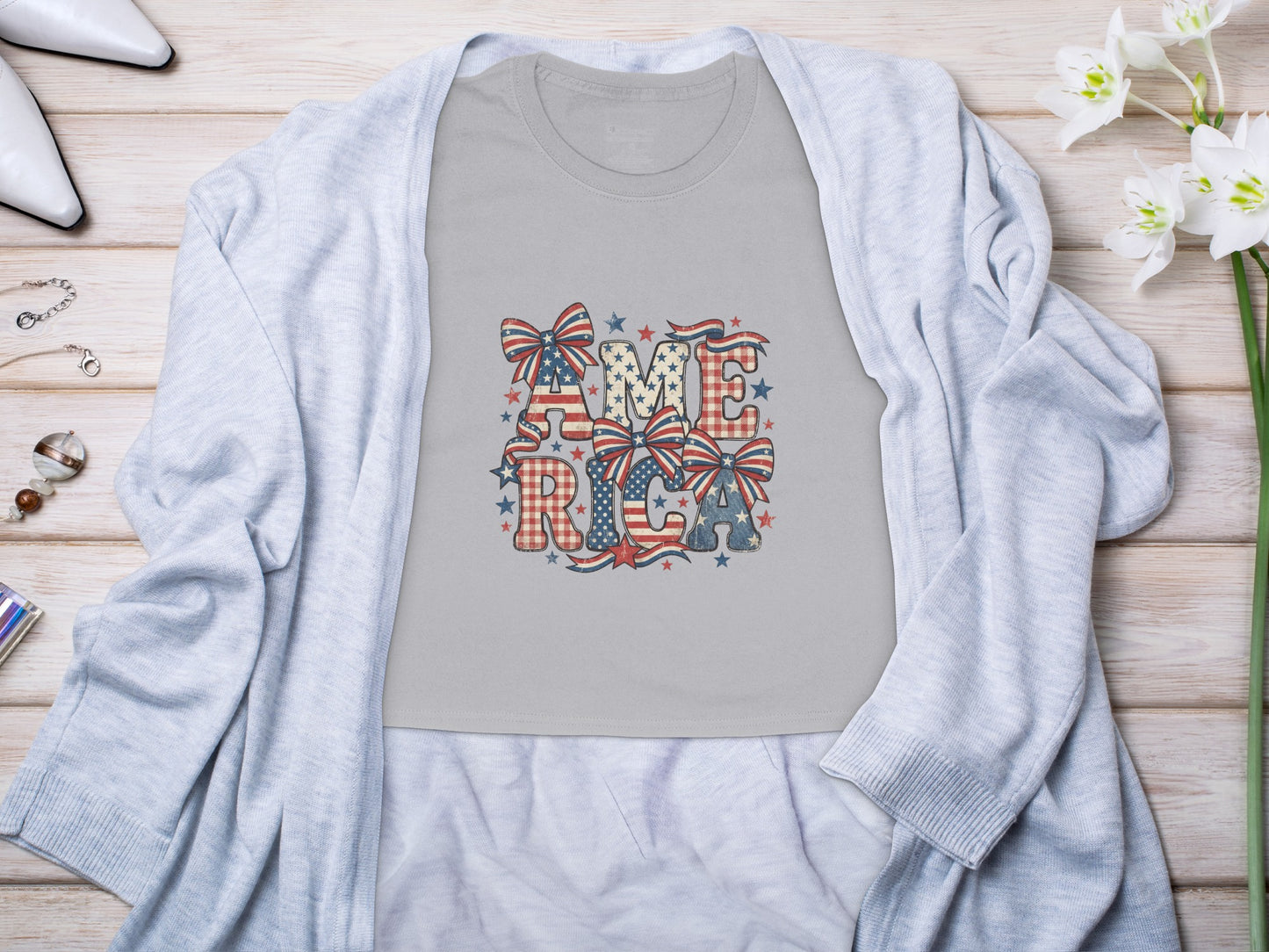 Gray t-shirt with "AMERICA" in patriotic font and patterns.