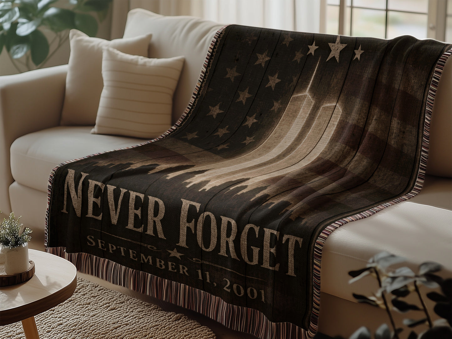 Throw blanket featuring "Never Forget September 11, 2001" text and twin towers.