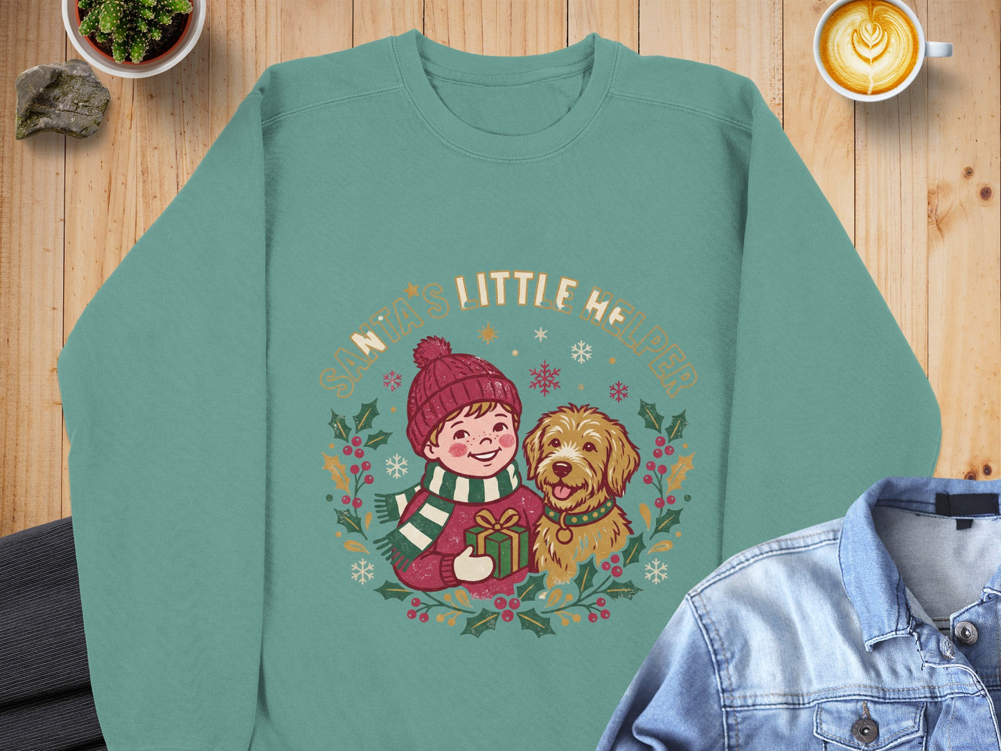 Green sweatshirt with a boy and dog graphic reading "Santa's Little Helper".