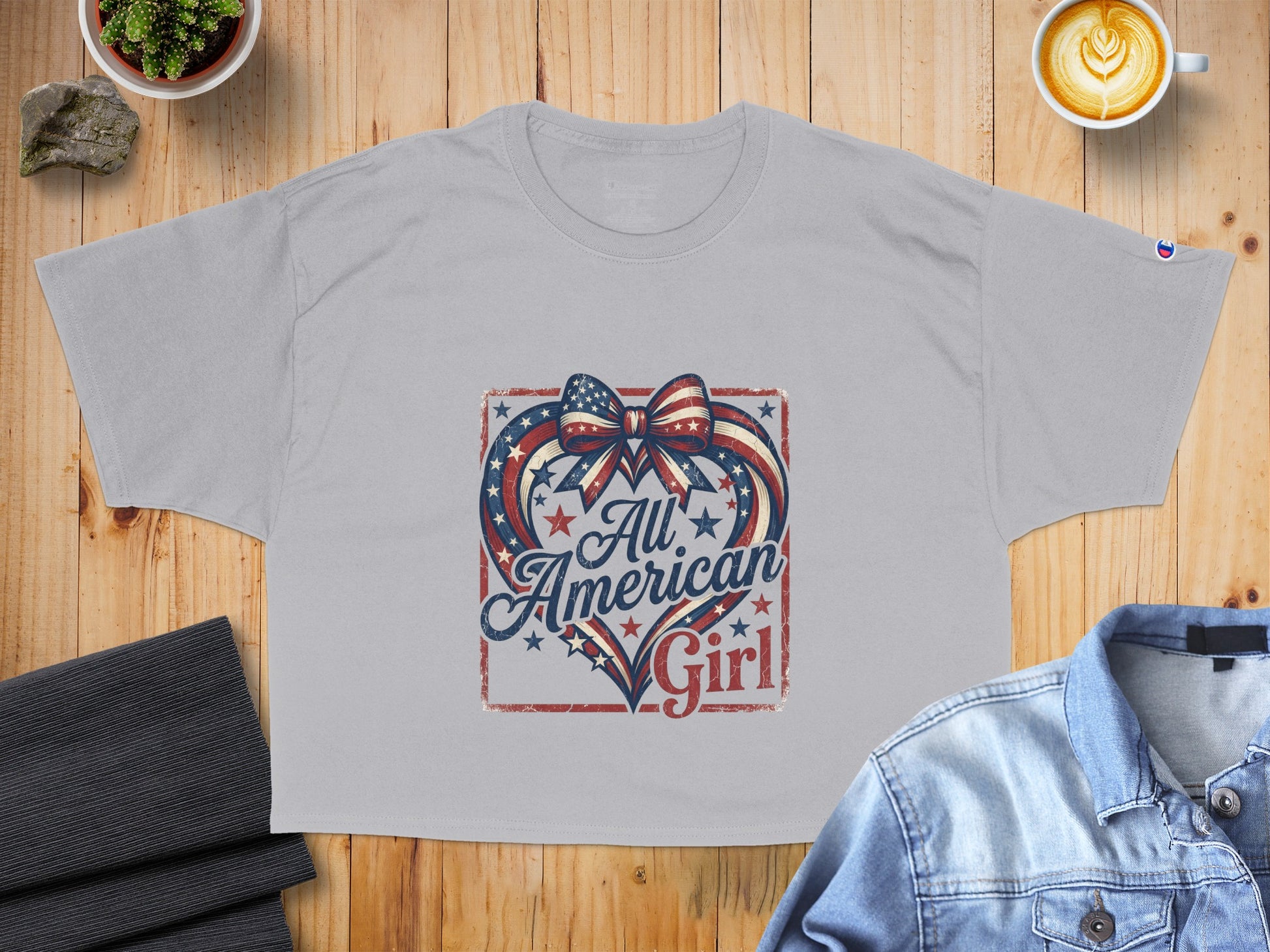 Grey t-shirt with "All American Girl" text and patriotic heart graphic.