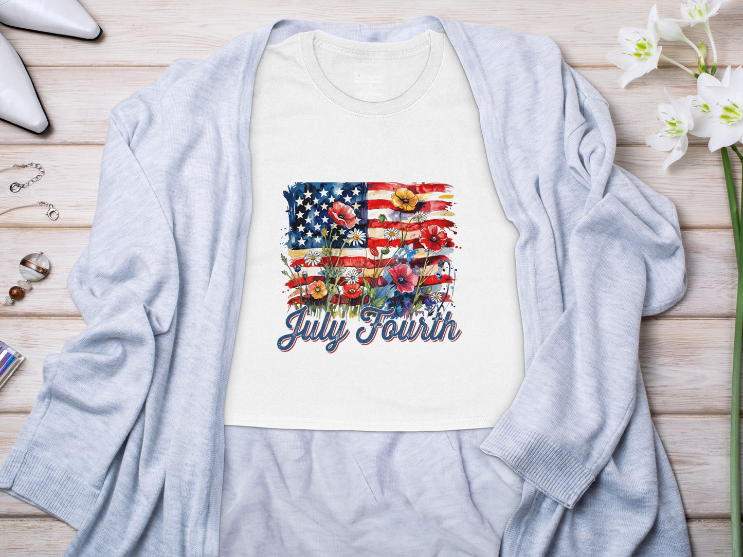 White t-shirt with American flag watercolor design and "July Fourth" text.