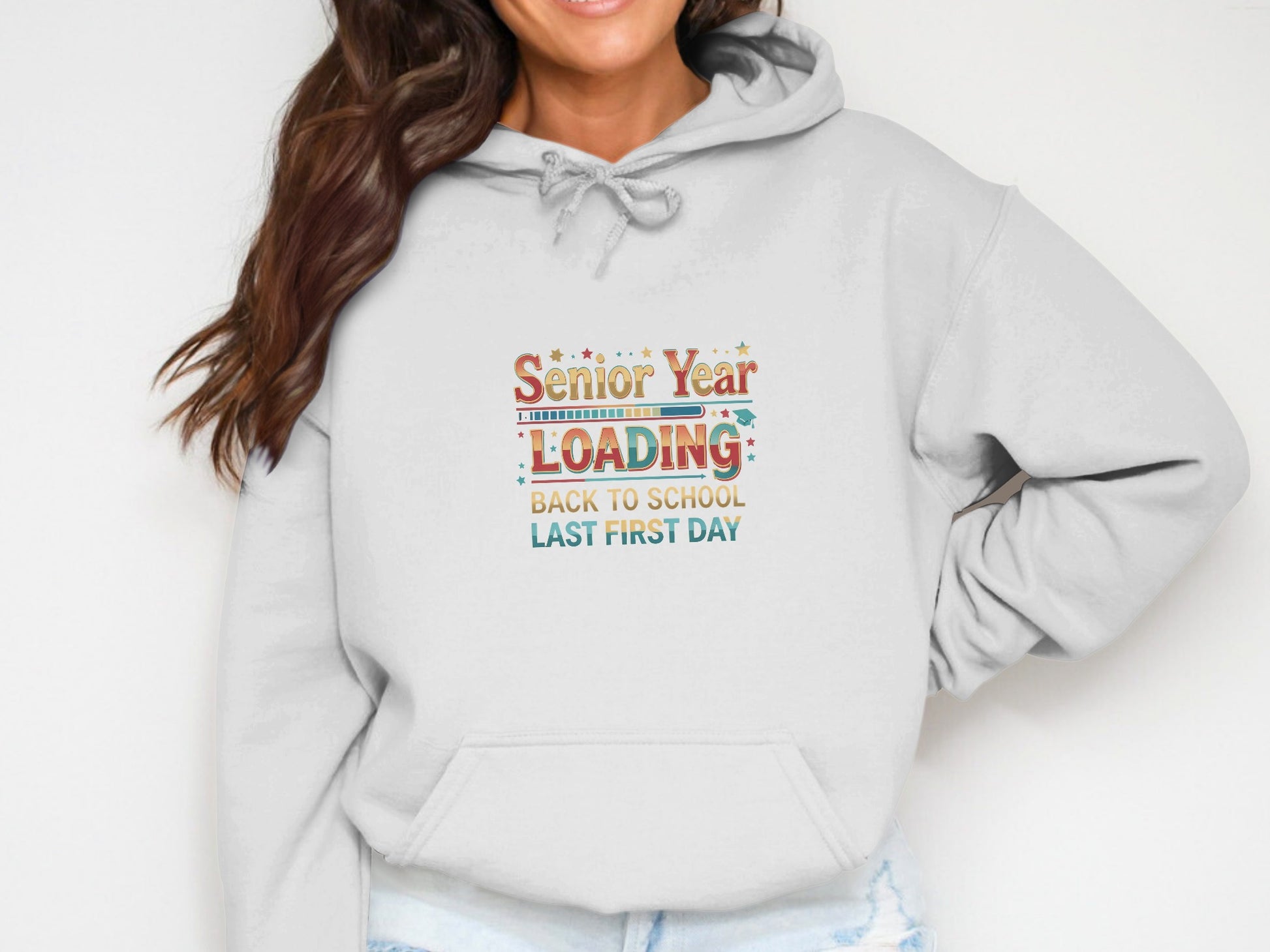 White sweatshirt with "Senior Year LOADING" and school-themed graphics.