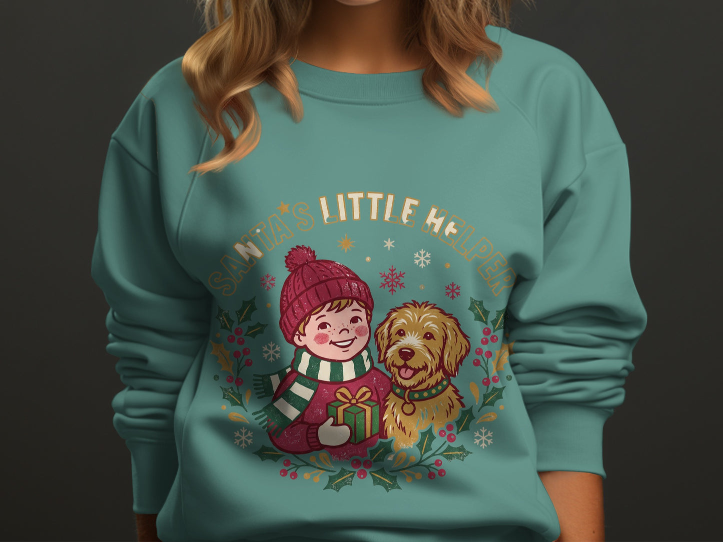 Holiday graphic sweatshirt with Santa's Little Helper text, child, dog, and gift.
