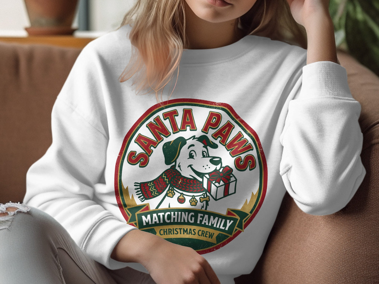 White crewneck sweatshirt with a "Santa Paws" dog graphic holding a gift.