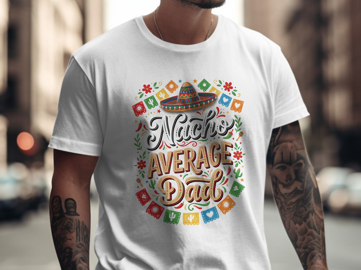 Nacho Average Dad text with sombrero and festive garland on a white t-shirt.