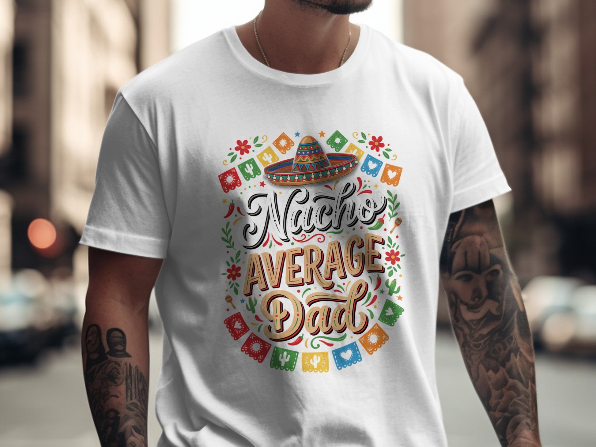 Nacho Average Dad text with sombrero and festive garland on a white t-shirt.