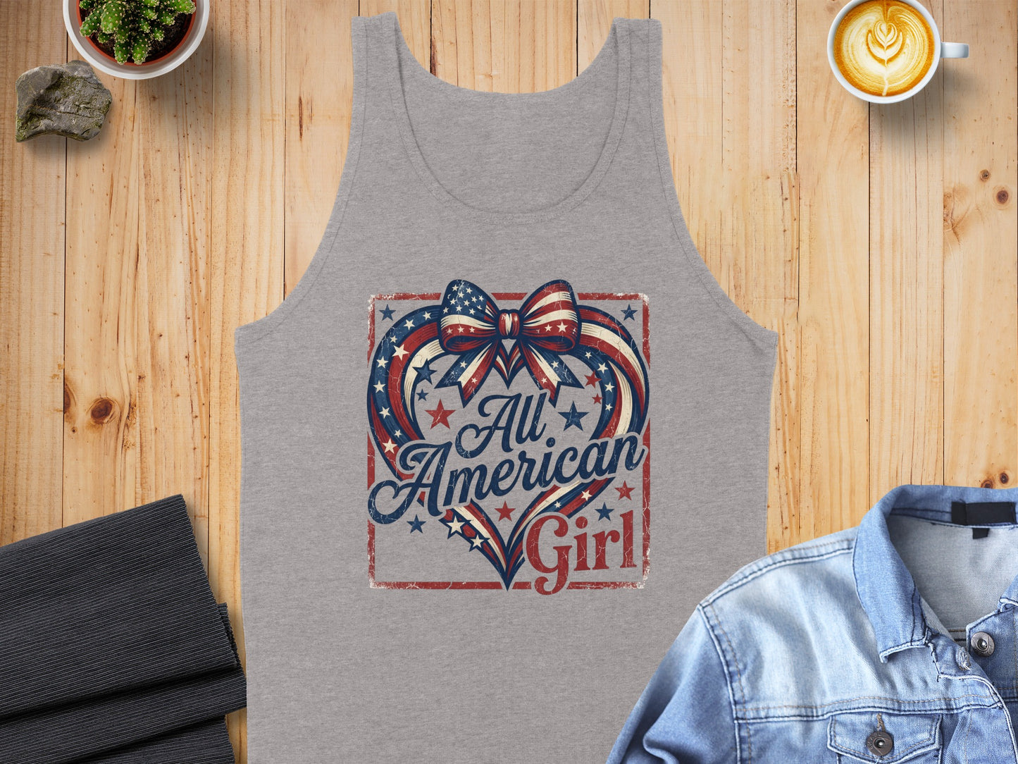 Gray tank top with "All American Girl" design featuring a patriotic heart and bow.