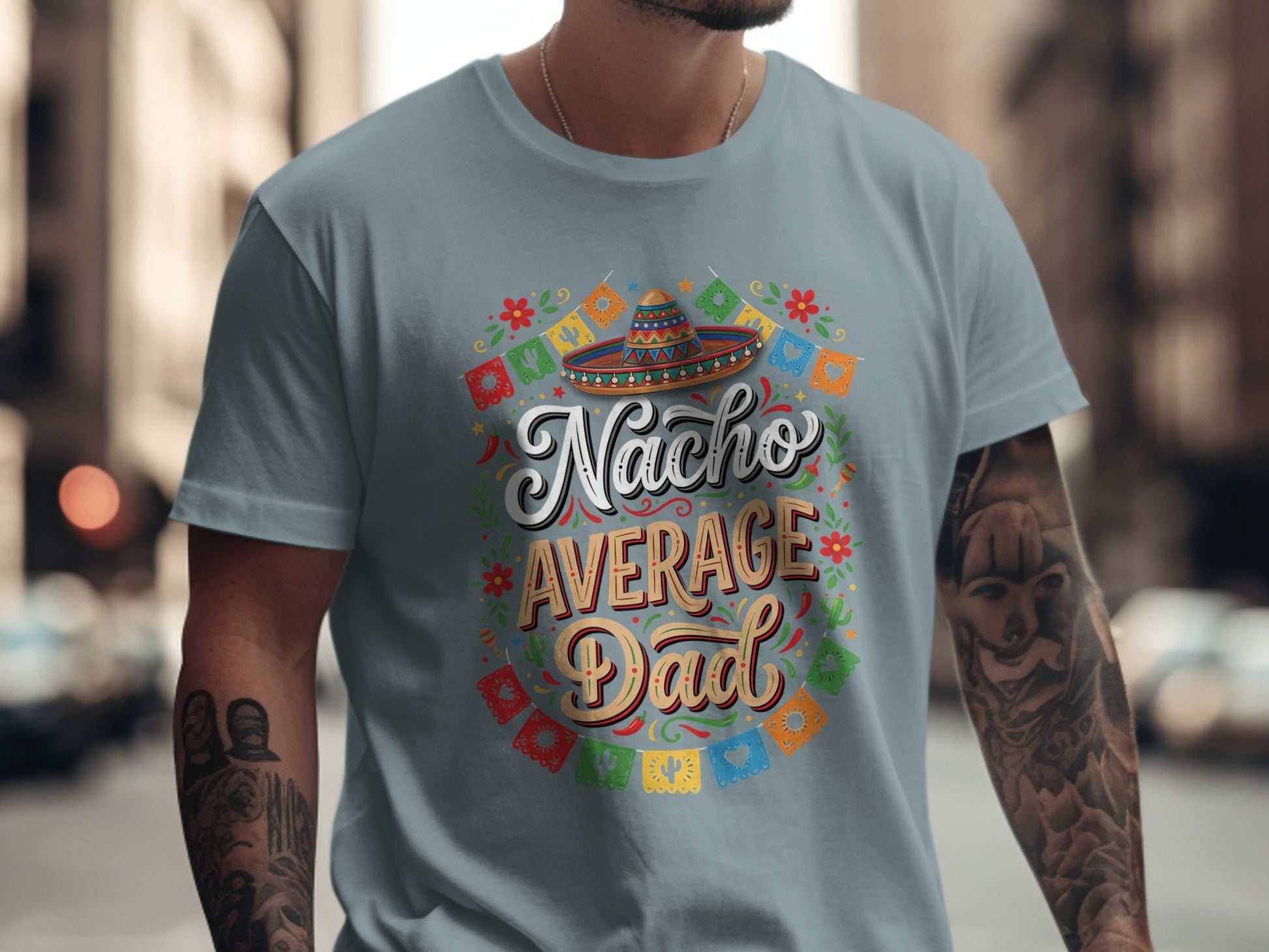 "Nacho Average Dad" text on a gray t-shirt with Mexican flag bunting and a sombrero.