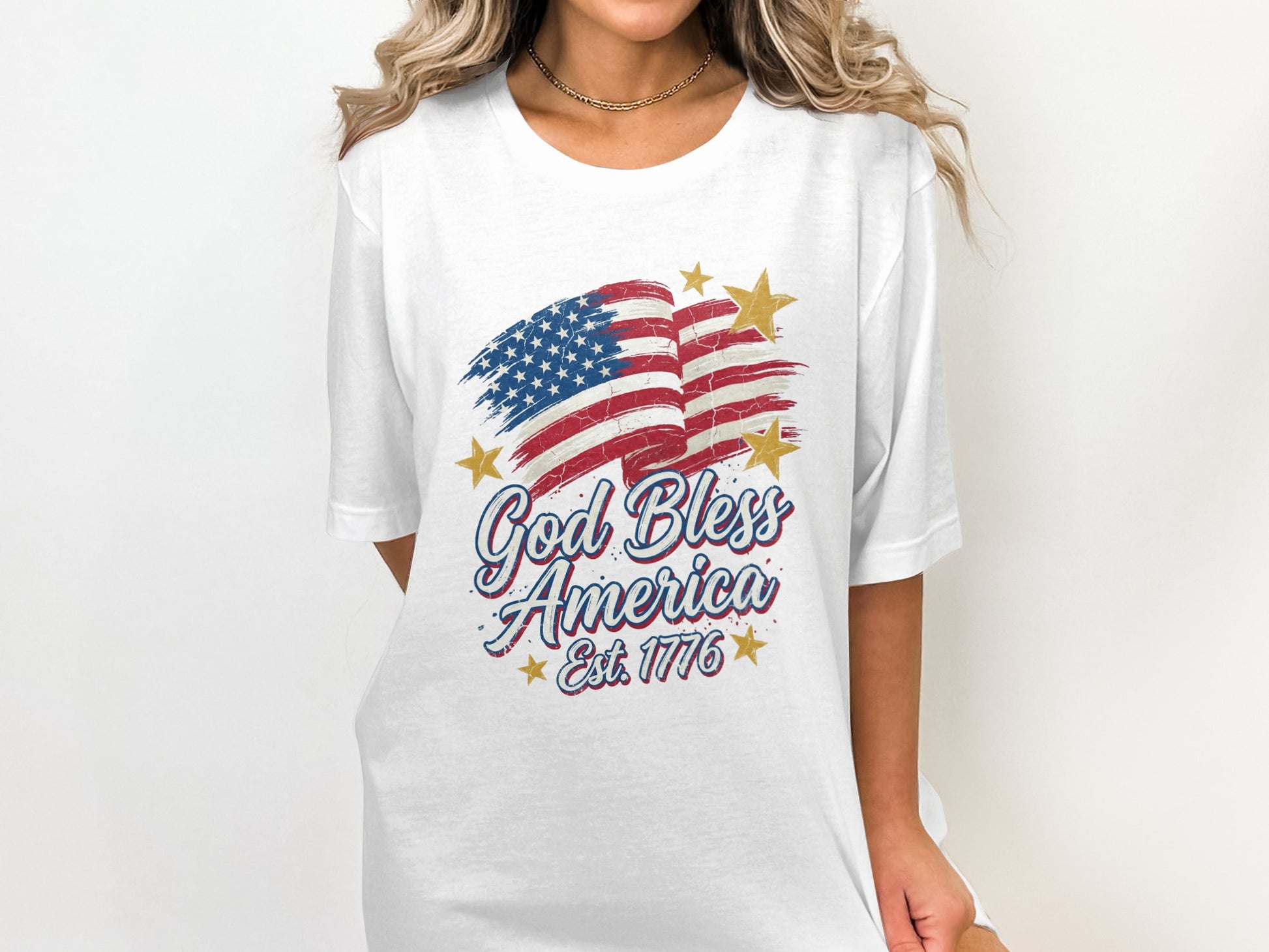 White t-shirt with distressed US flag and "God Bless America Est. 1776".