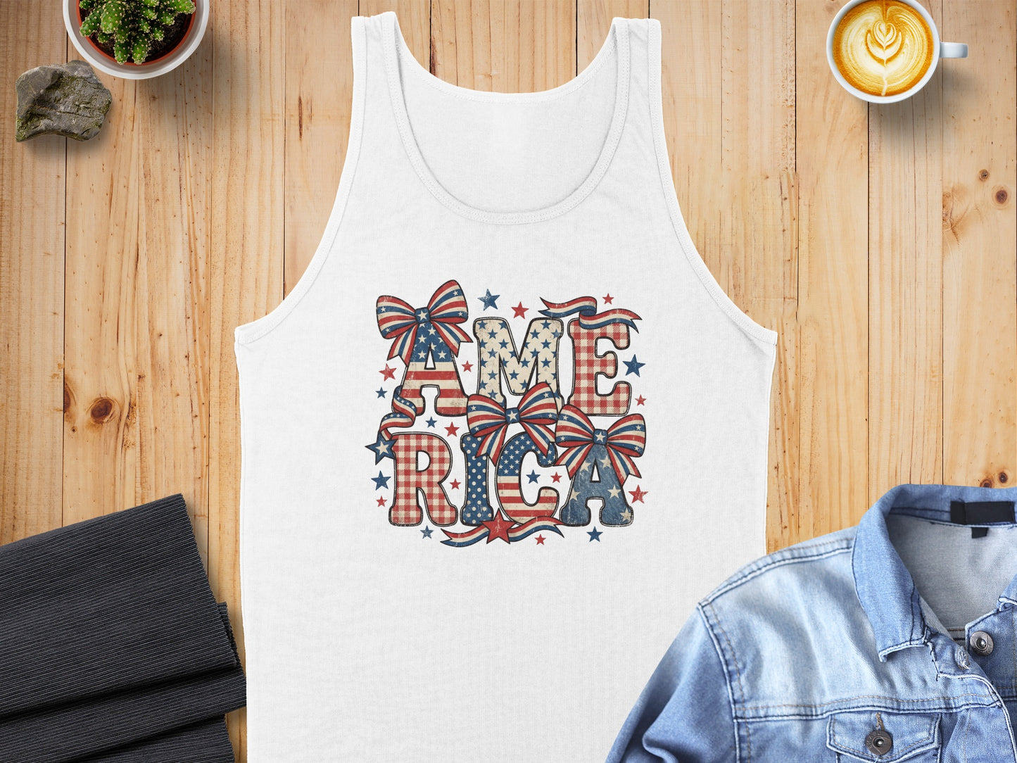 White tank top with "AMERICA" in patriotic letters and bows.
