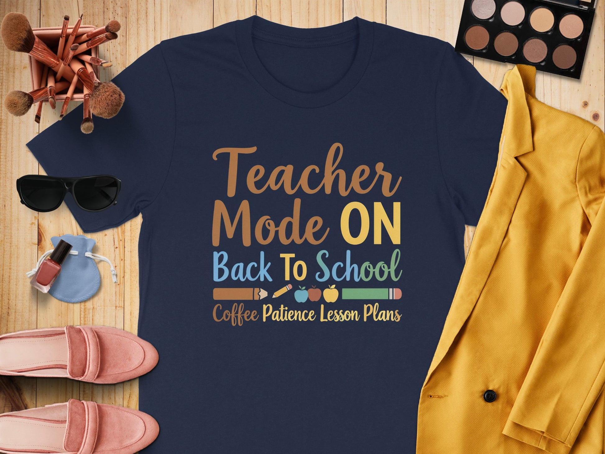 Navy T-shirt with "Teacher Mode ON Back To School" text and school-related graphics.