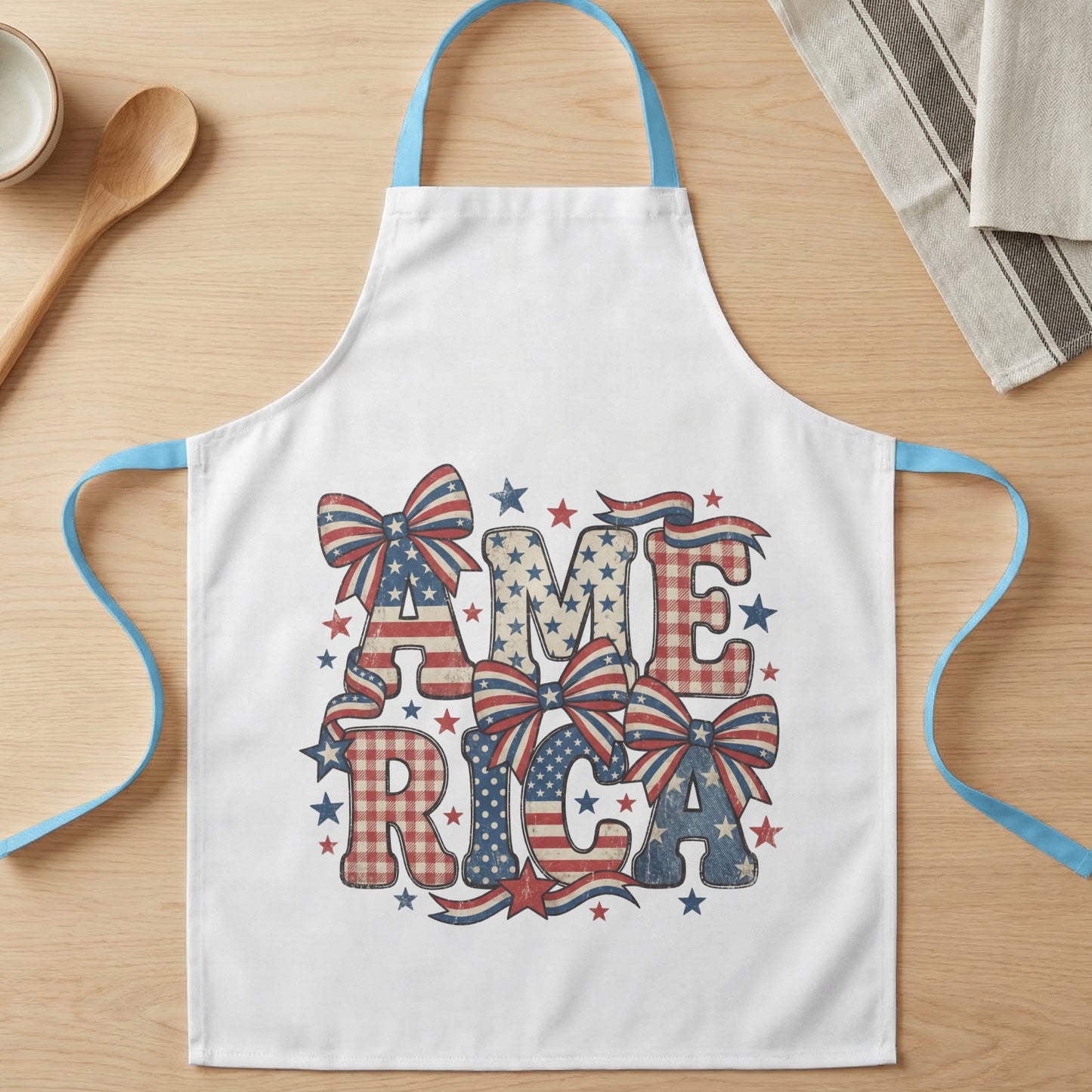 White apron with "AMERICA" in distressed patriotic letters and bows.