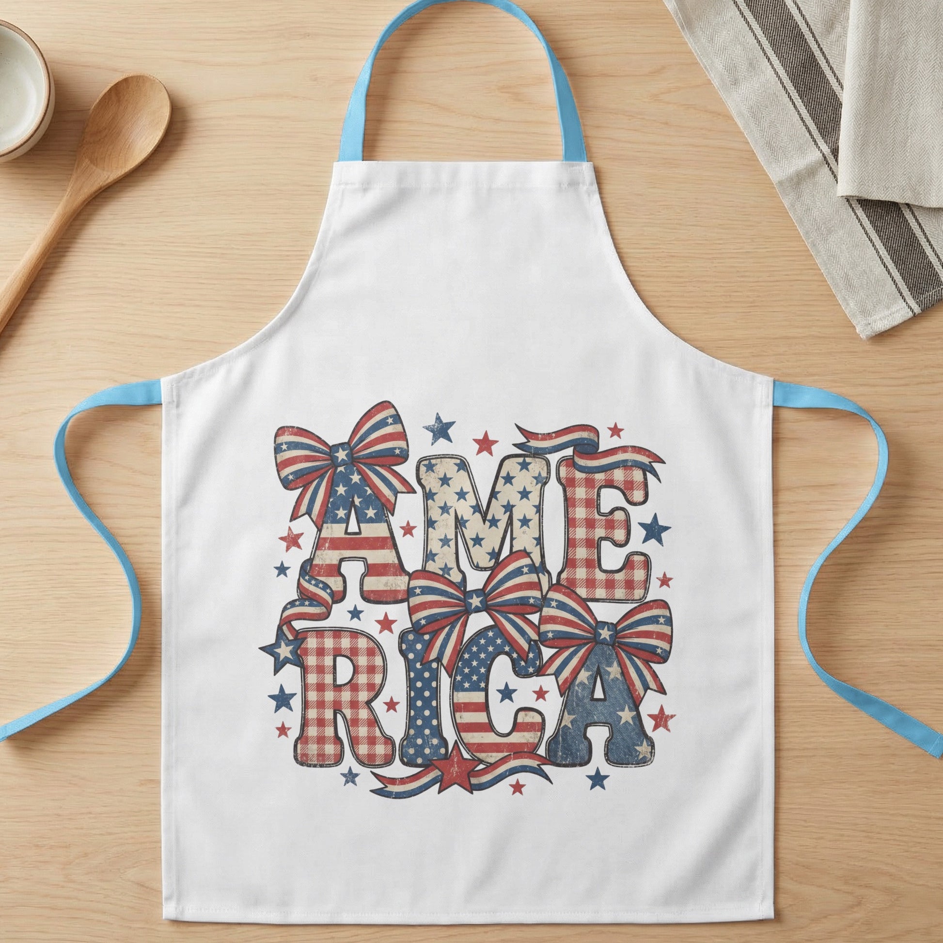 White apron with "AMERICA" in distressed patriotic letters and bows.