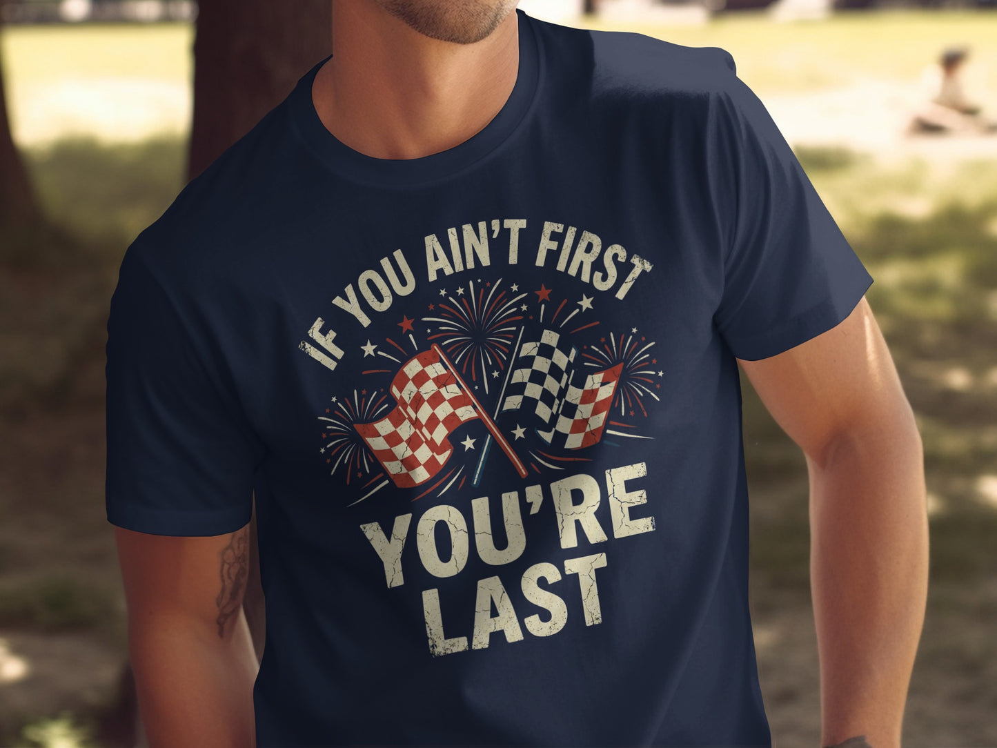 Navy t-shirt with "IF YOU AIN'T FIRST YOU'RE LAST" and checkered flags.