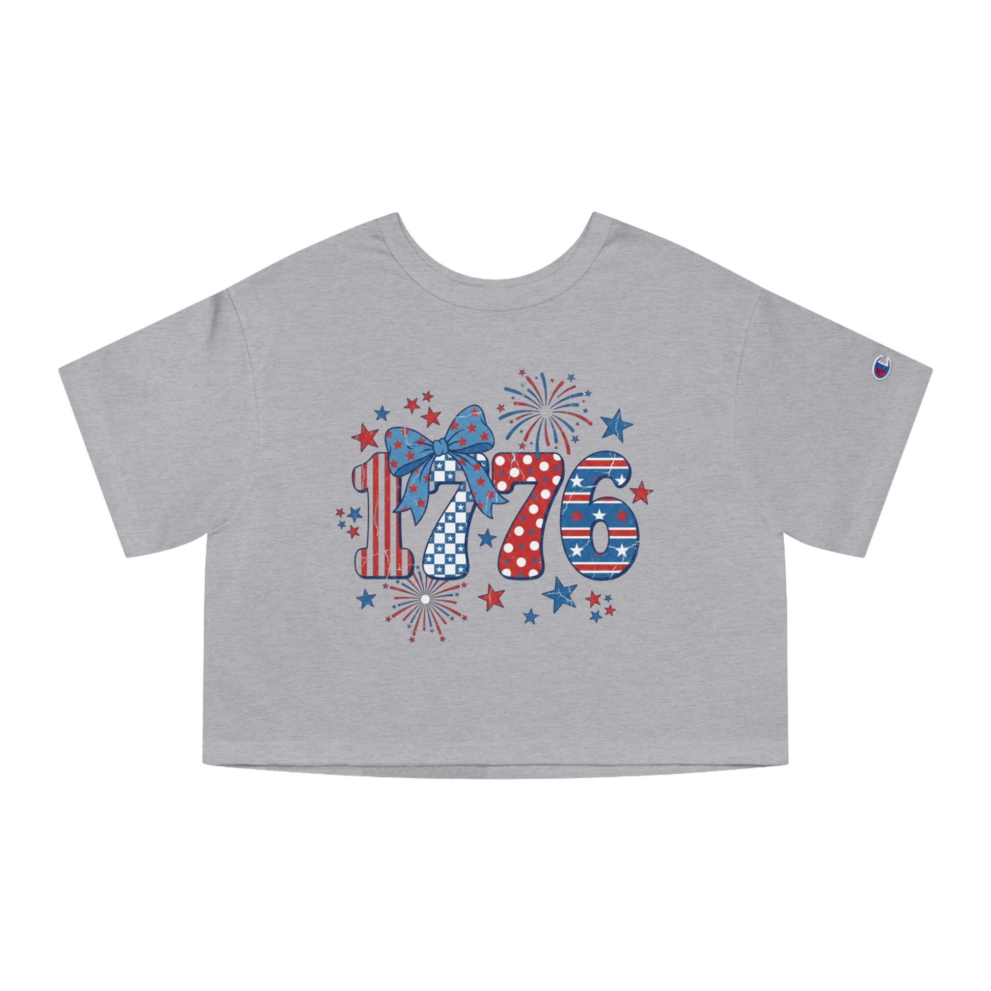 Grey crop top with "1776" in distressed patriotic patterns and fireworks.