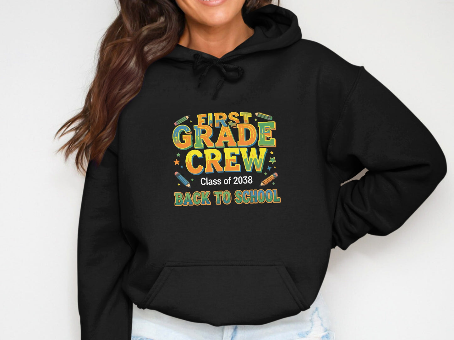 Black hoodie with "First Grade Crew Class of 2038 Back To School" graphic.