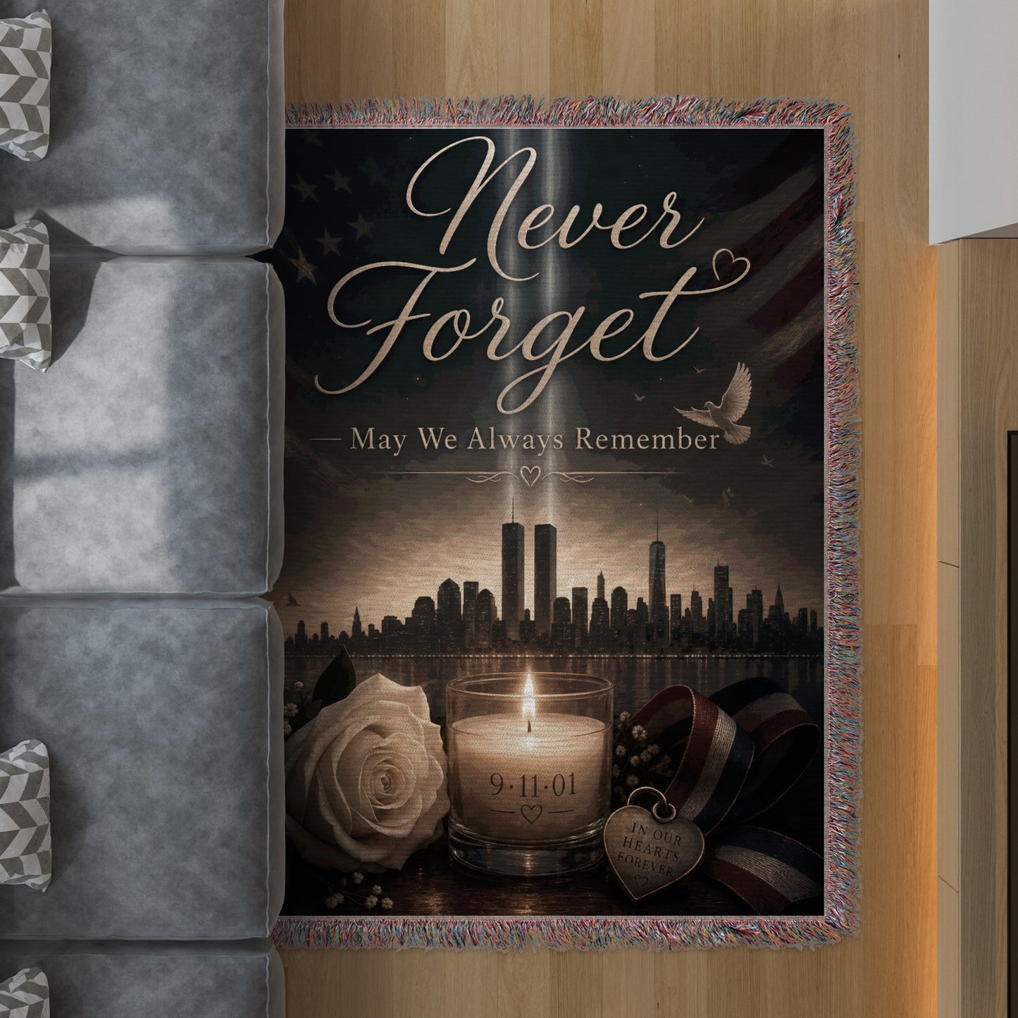 Memorial blanket with text "Never Forget May We Always Remember" and image of twin towers.