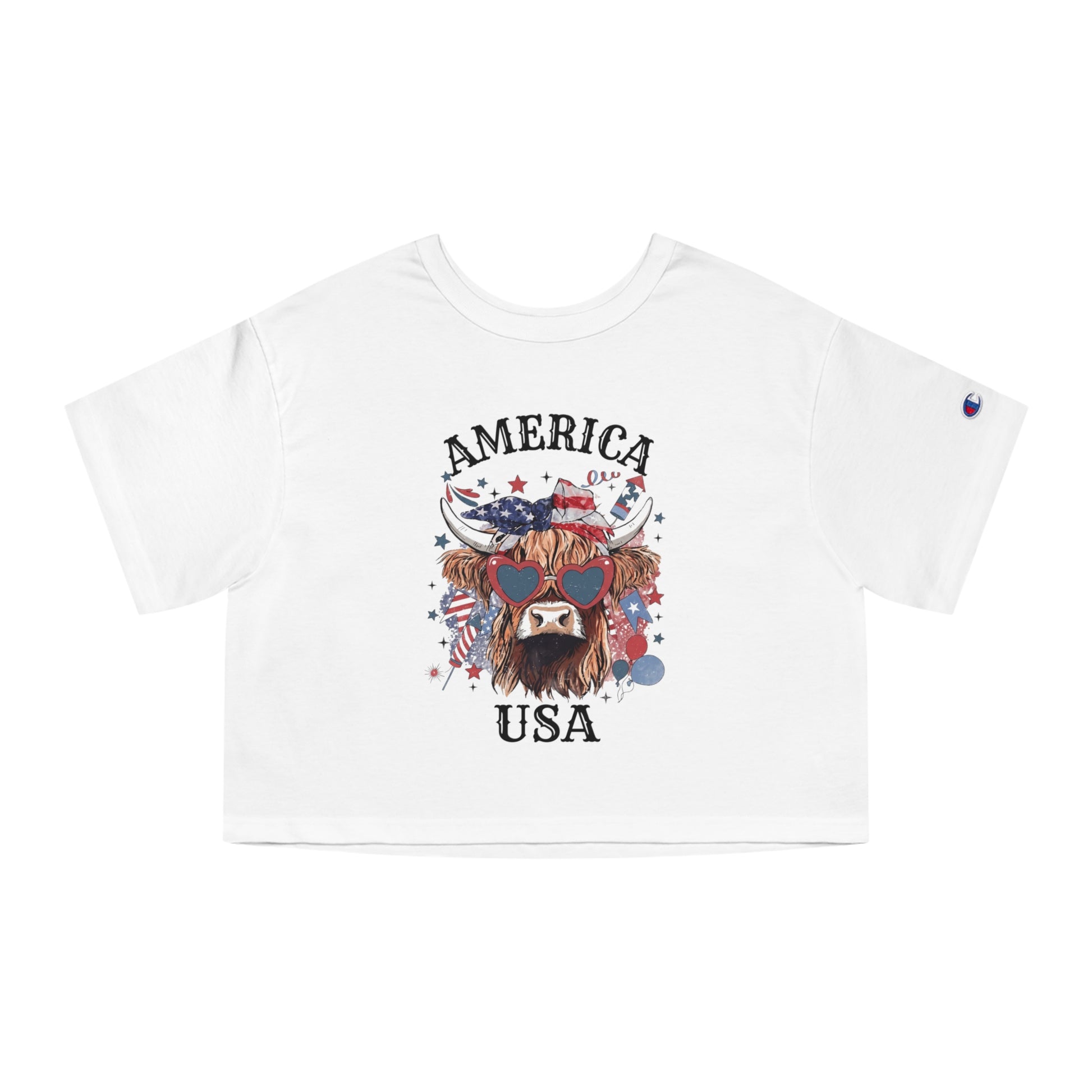 White cropped t-shirt with a Highland cow graphic wearing heart sunglasses and patriotic bandana, text "AMERICA USA".