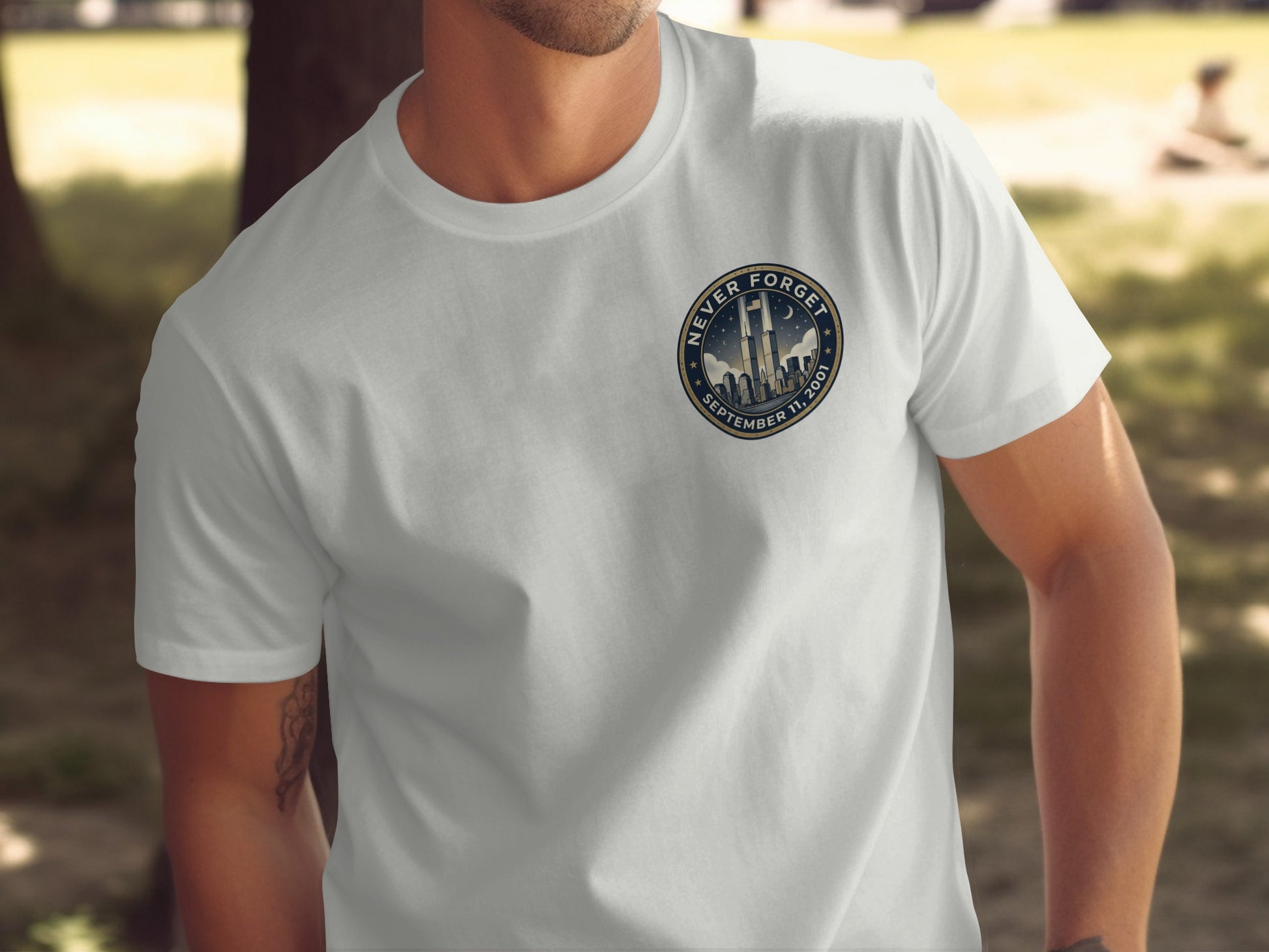 White t-shirt with "Never Forget September 11, 2001" badge featuring Twin Towers.