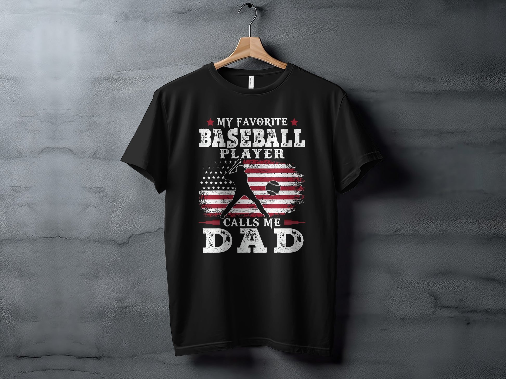 Black t-shirt with "MY FAVORITE BASEBALL PLAYER CALLS ME DAD" and American flag graphic.