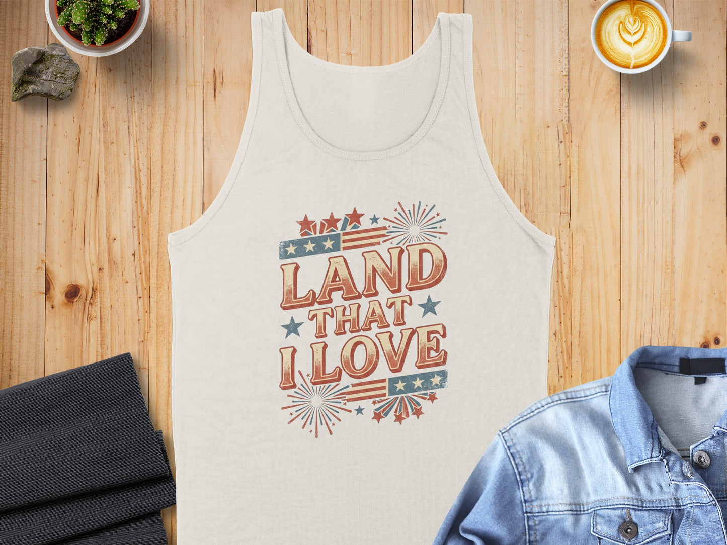 White tank top with vintage patriotic "Land That I Love" graphic.
