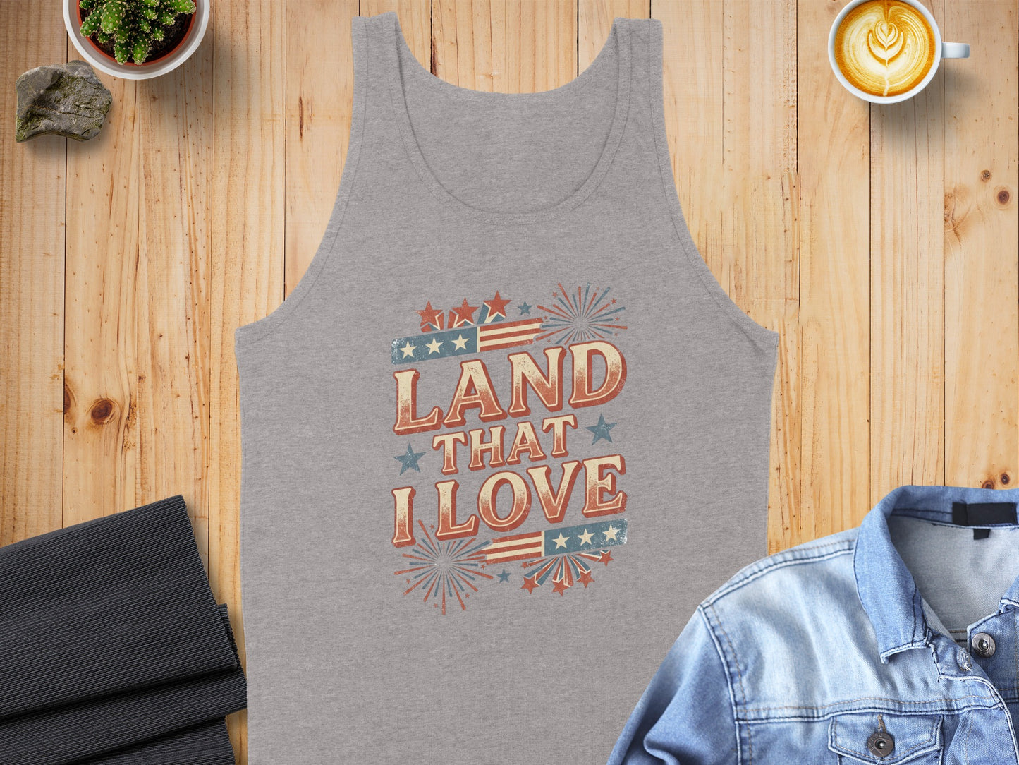 Gray tank top with "Land That I Love" text and patriotic graphics.