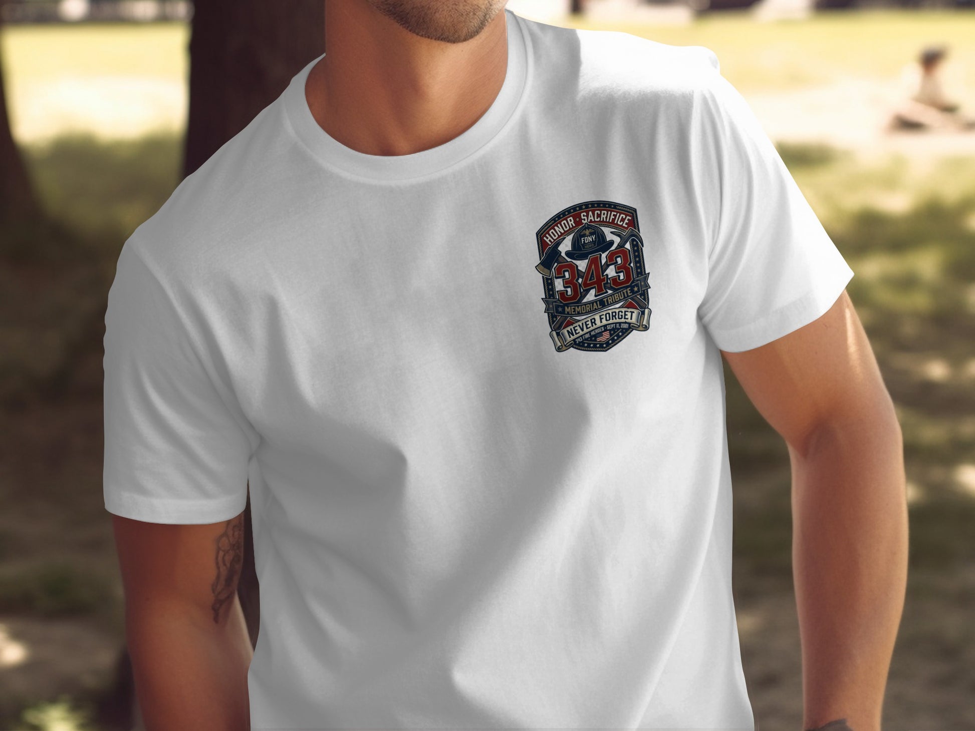 White t-shirt with a "343 Memorial Tribute Never Forget" graphic featuring a fire helmet.