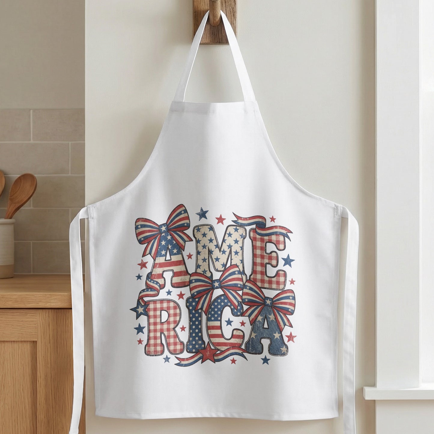 White apron with "AMERICA" in patriotic letters and bows.