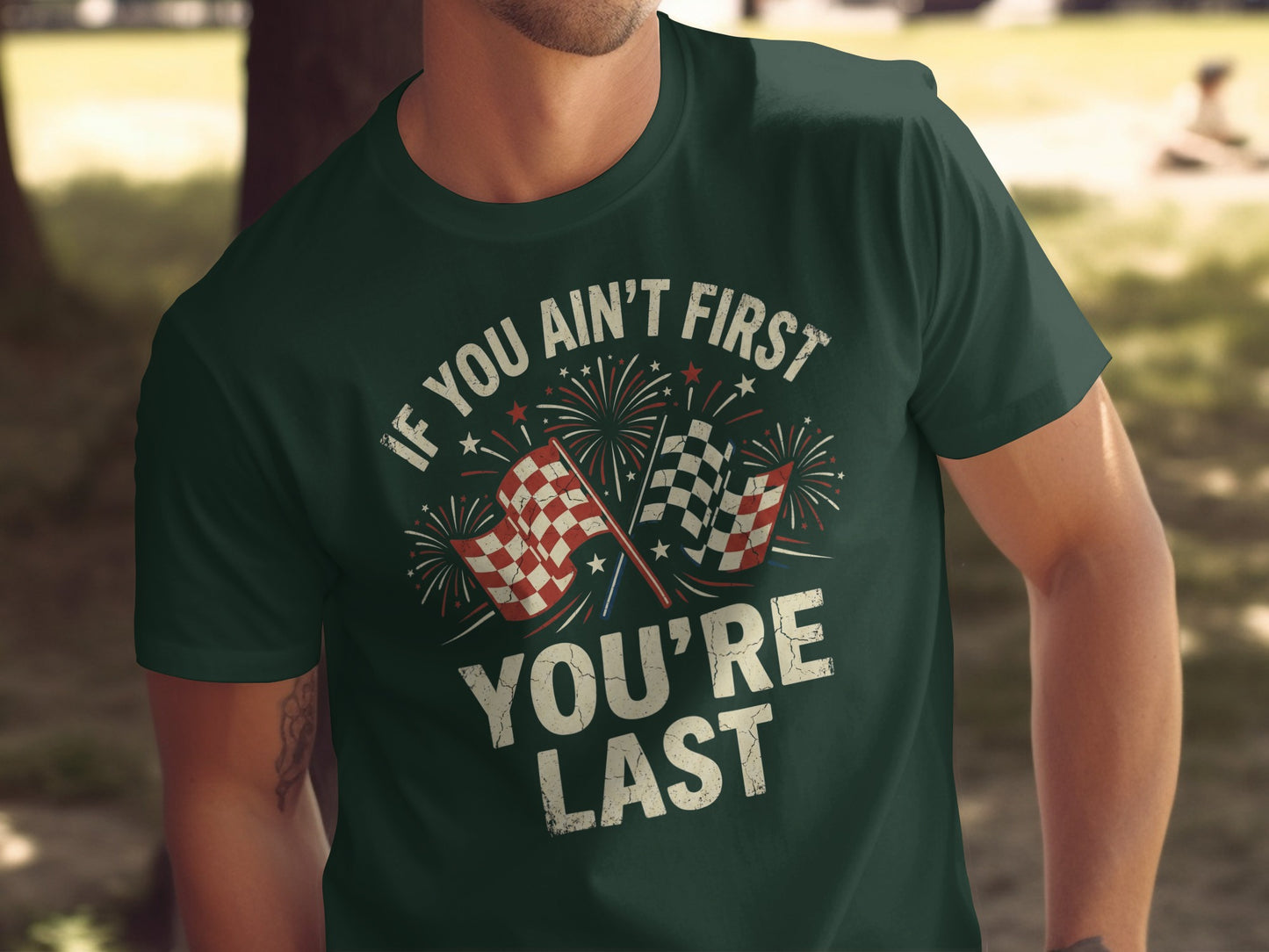 Dark green t-shirt with "IF YOU AIN'T FIRST YOU'RE LAST" and checkered flags.