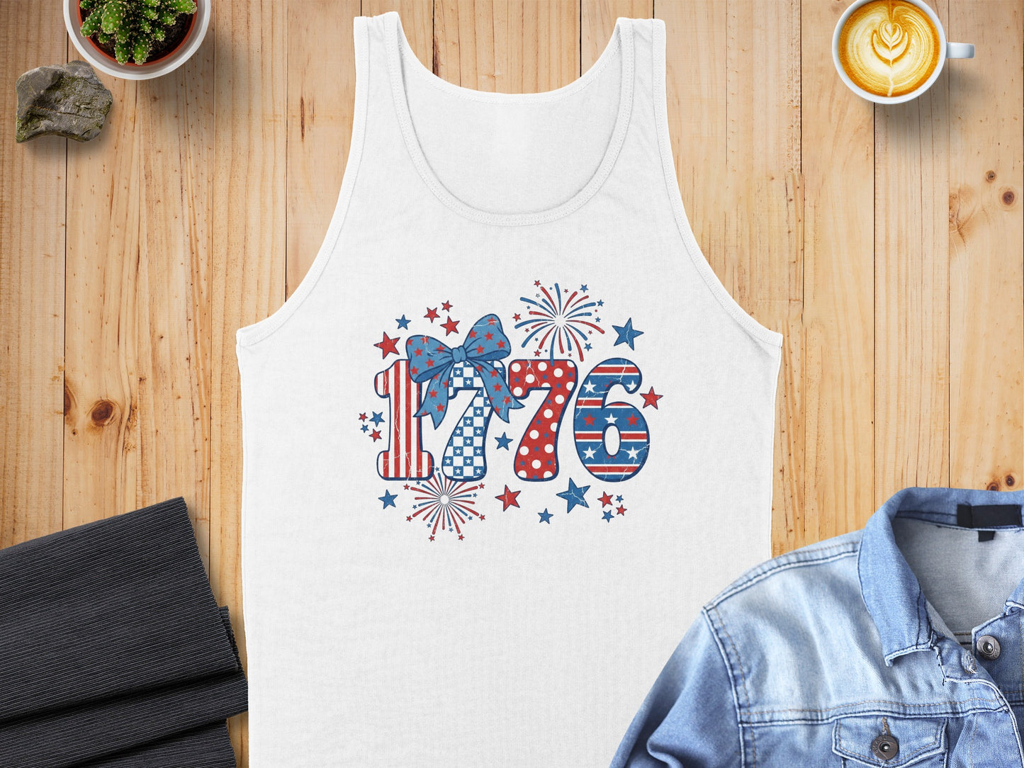 White tank top with patriotic "1776" graphic and fireworks design.