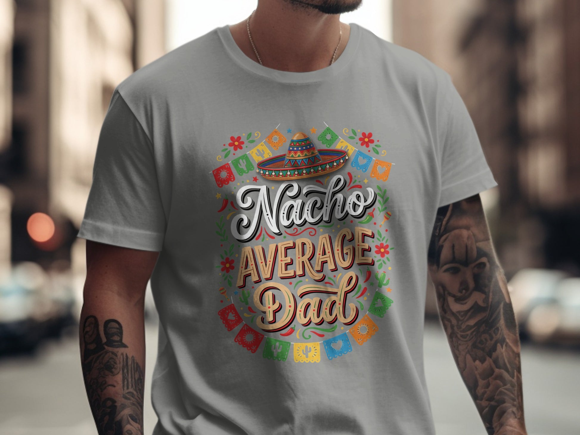 Gray t-shirt with "Nacho Average Dad" text and festive Mexican-themed graphics.