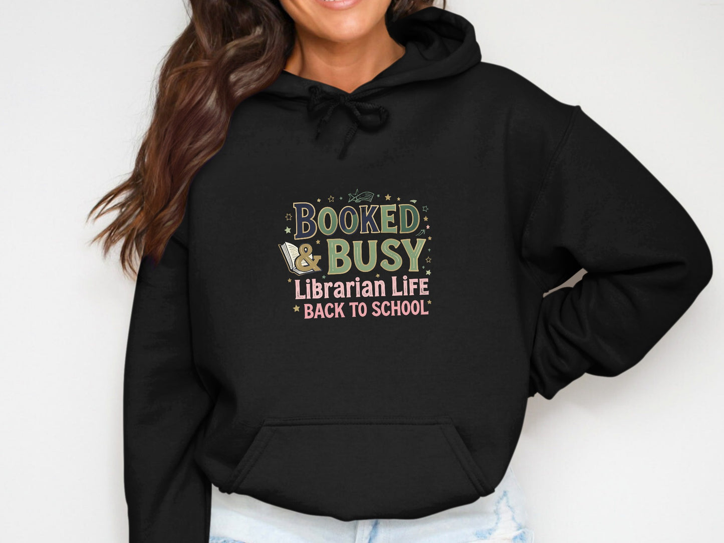 Black hoodie with "BOOKED & BUSY Librarian Life BACK TO SCHOOL" design.