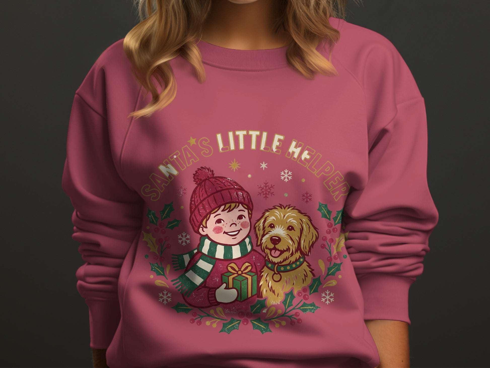 Illustration of a boy and dog with "Santa's Little Helper" text on a pink sweatshirt.