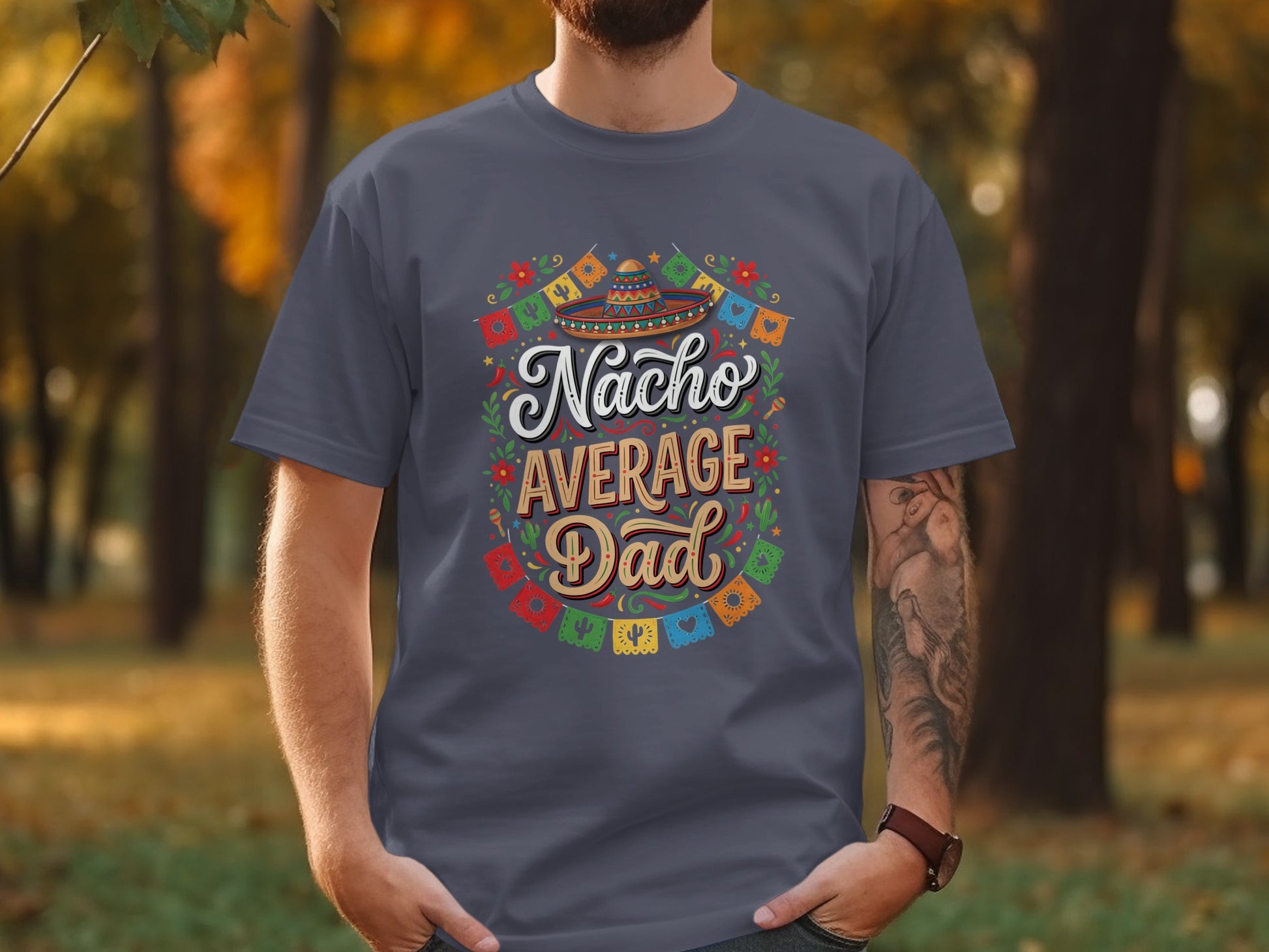 Nacho Average Dad text with festive colorful decorations on a dark gray t-shirt.
