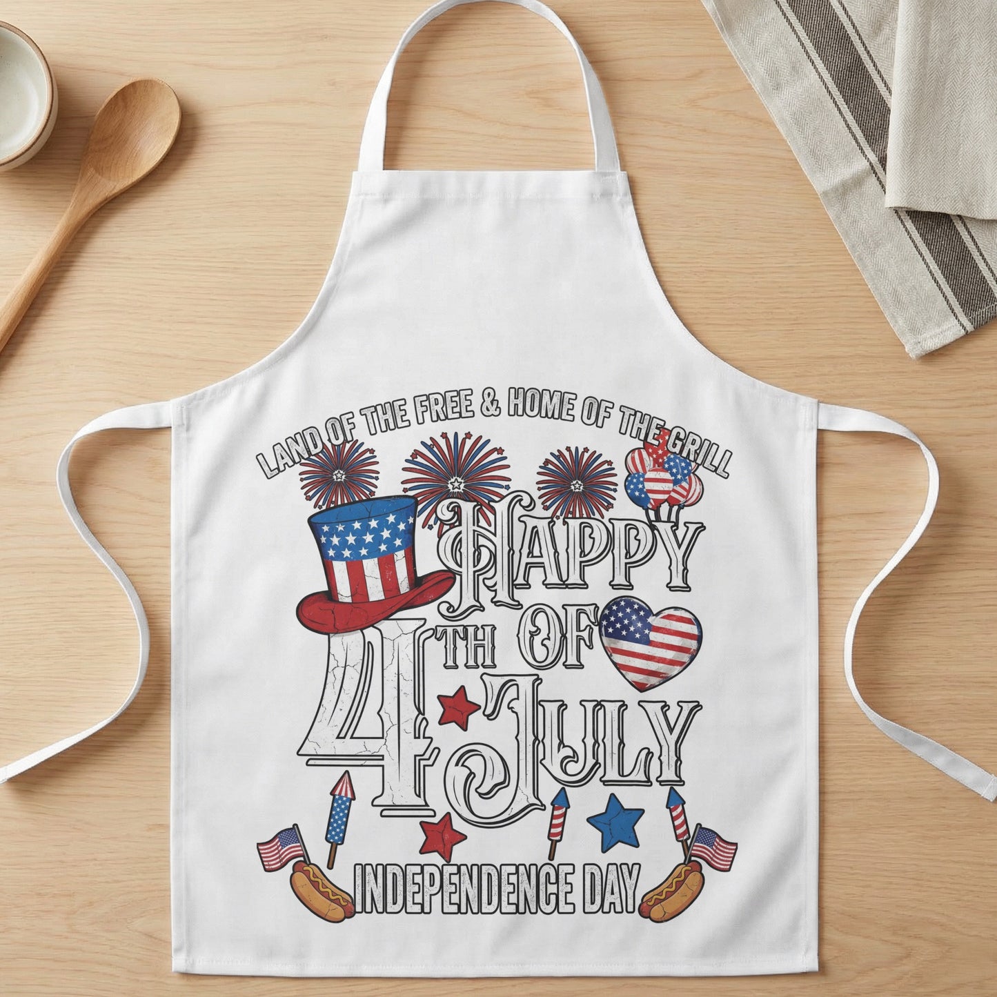 White apron with distressed patriotic graphics and text for July 4th.