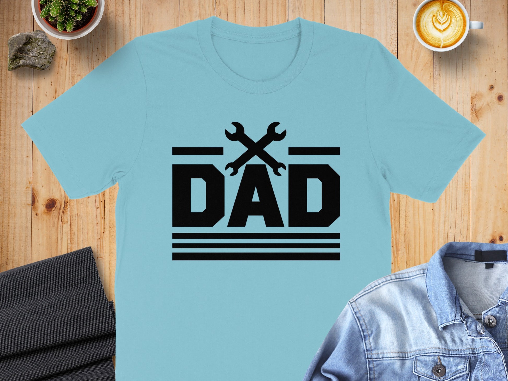 Black graphic of "DAD" with crossed wrenches above for Father's Day.