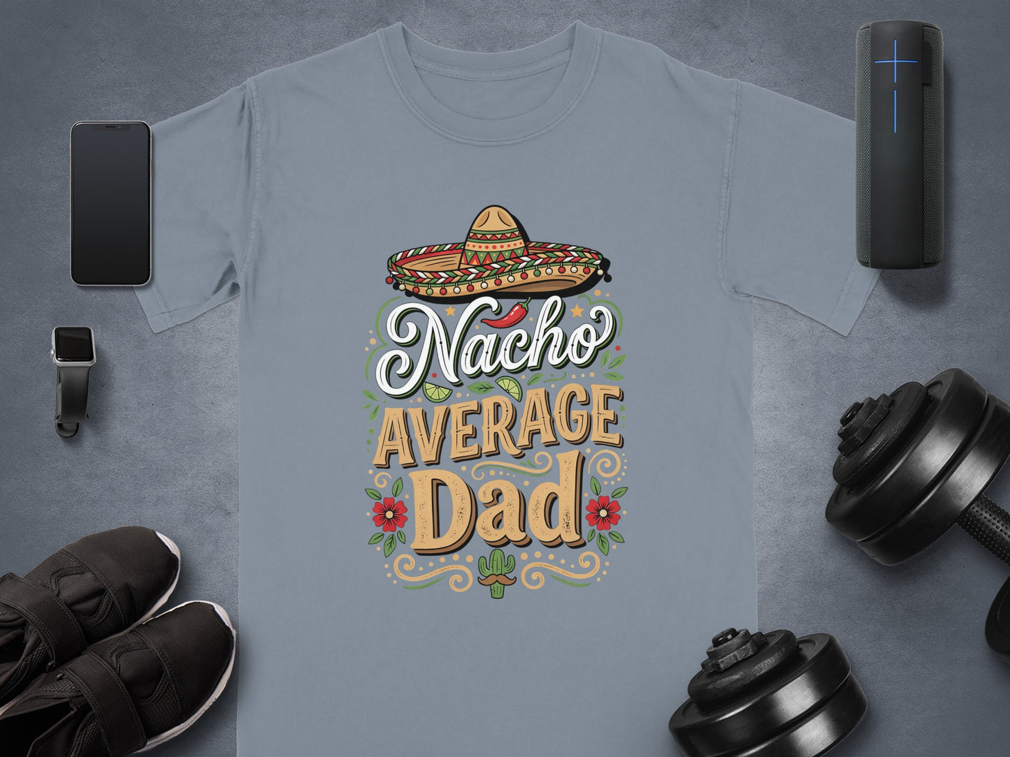 Nacho Average Dad graphic tee with sombrero and decorative elements.