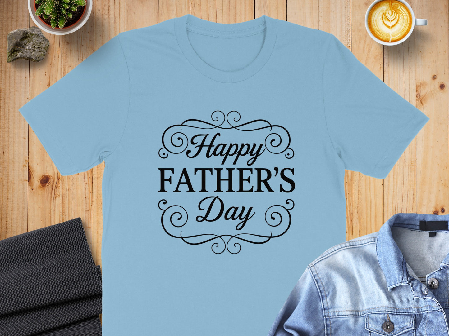 Light blue t-shirt with "Happy Father's Day" text in ornate black font.