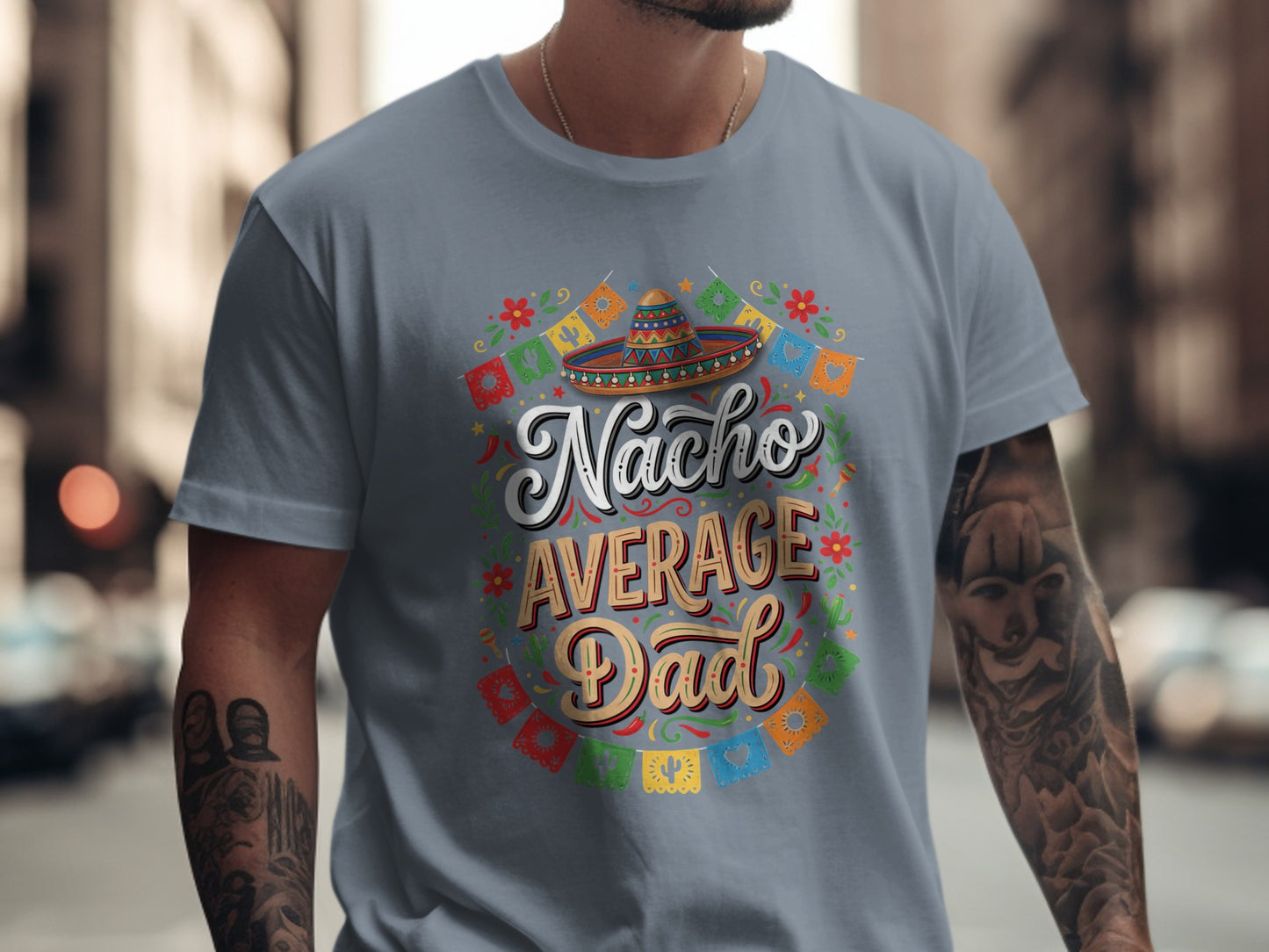 Nacho Average Dad graphic on gray t-shirt with festive decorations.