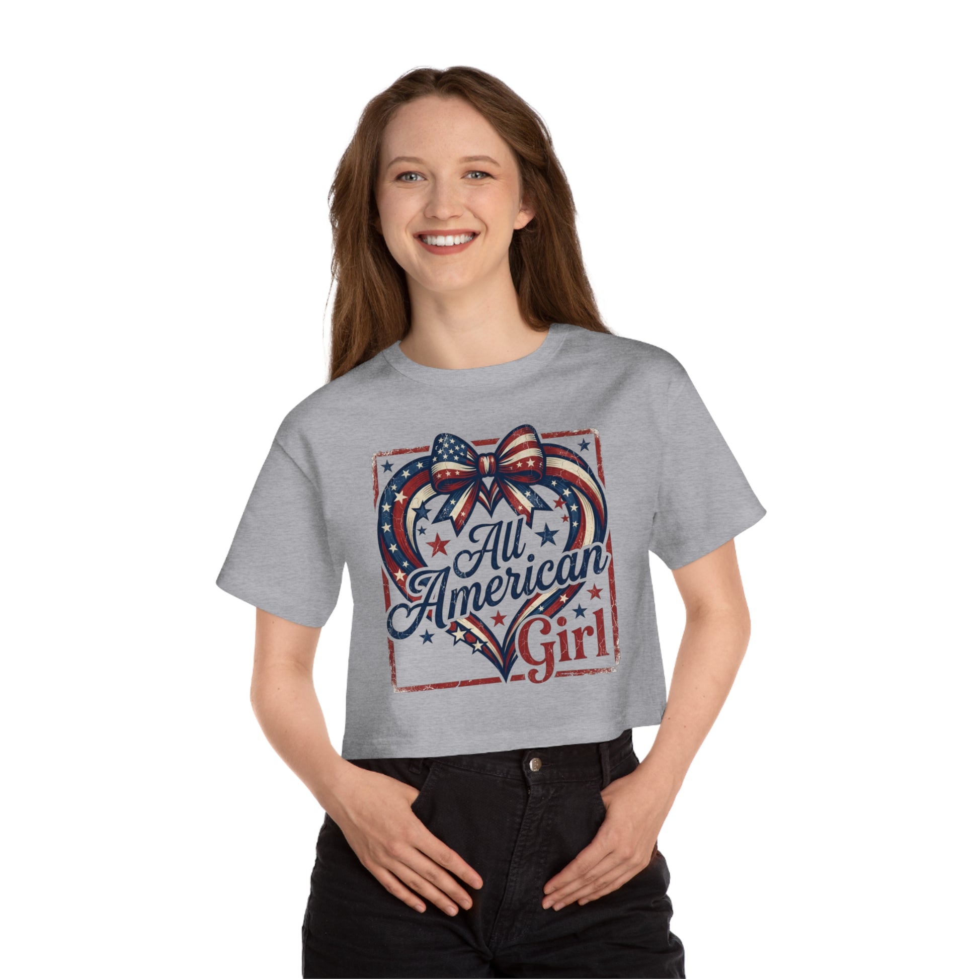 Gray crop top with distressed graphic of a heart with bow, stars, and "All American Girl" text.