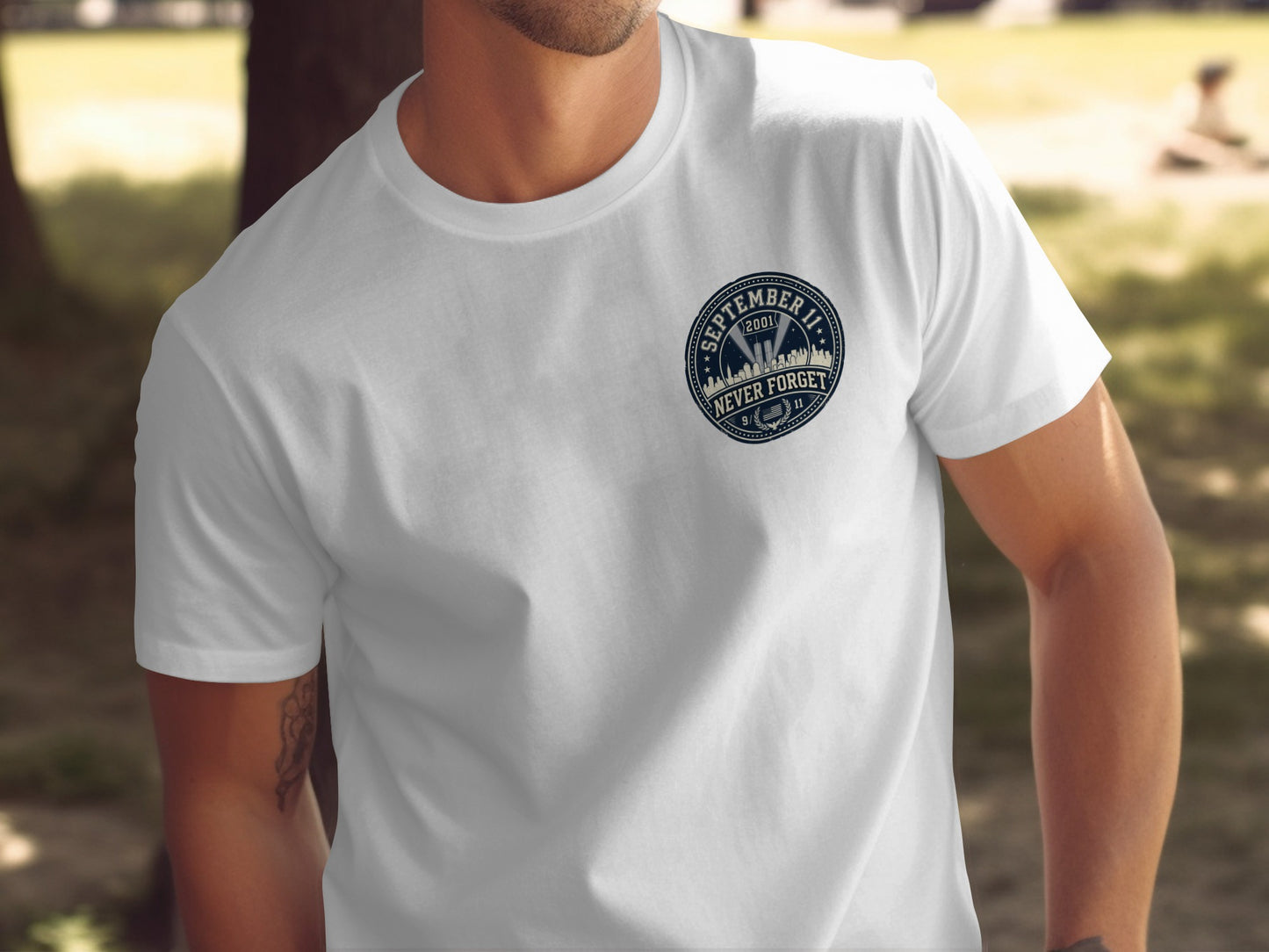 White t-shirt with "September 11 2001 Never Forget" graphic.
