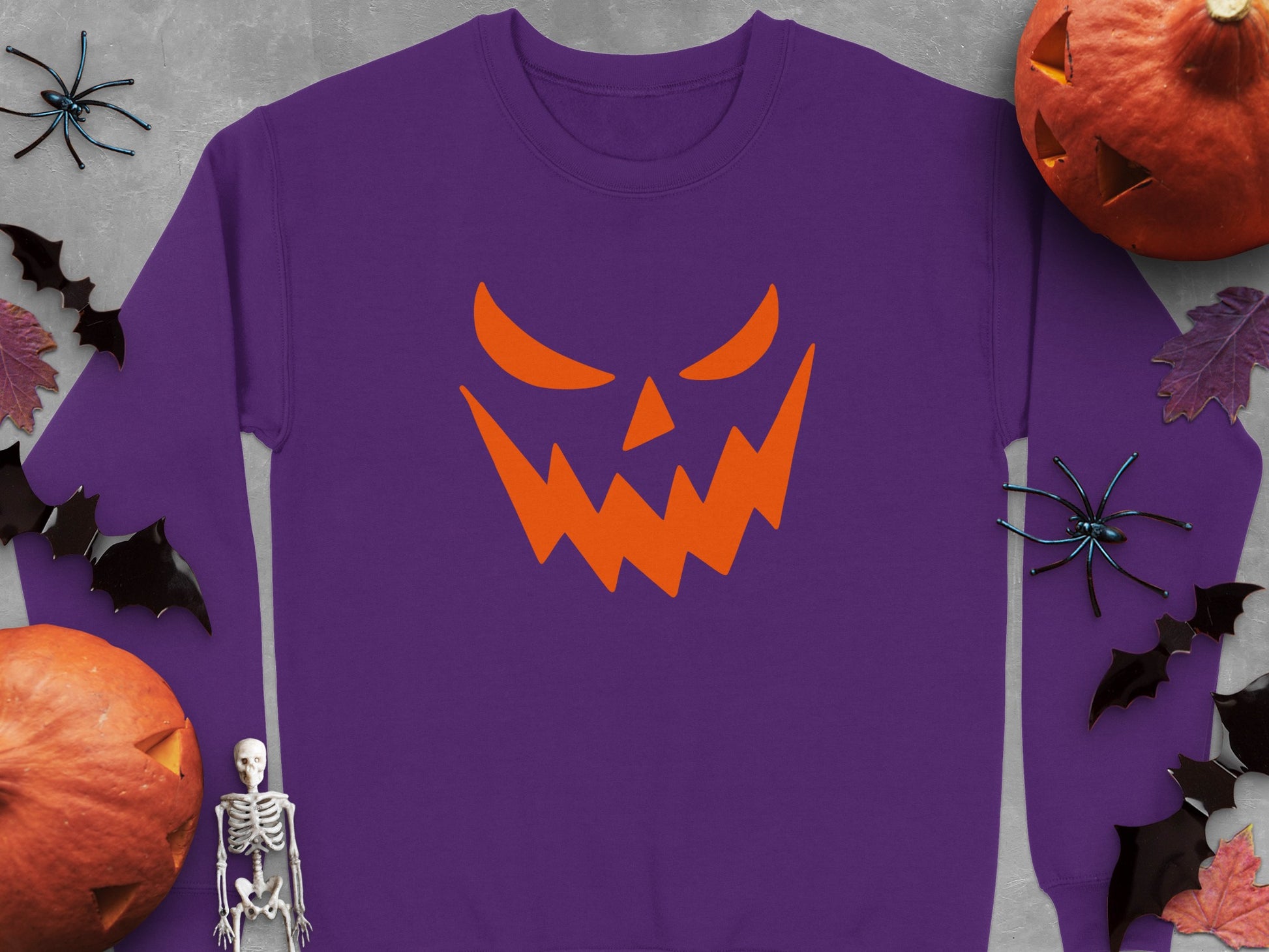 Spooky Pumpkin Face Design on Purple Sweatshirt product