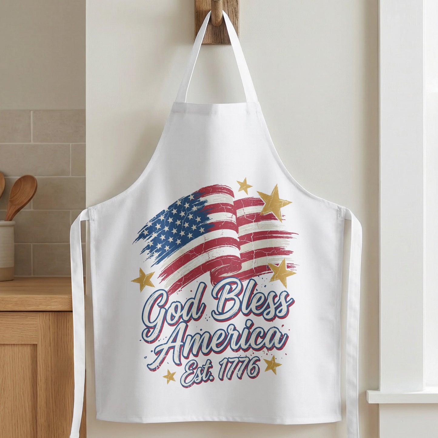 White apron with distressed American flag and "God Bless America Est. 1776" text.