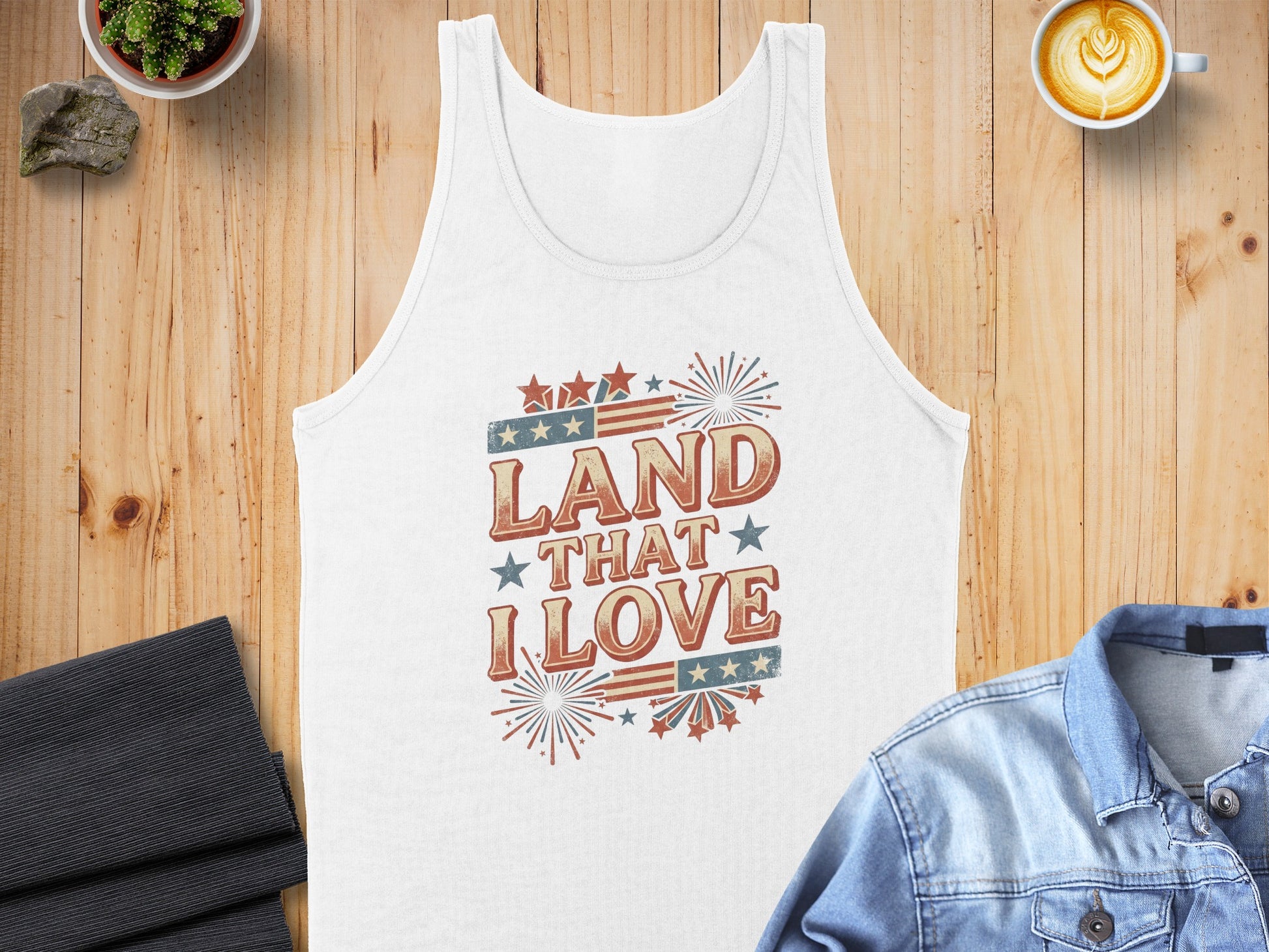 White tank top with "LAND THAT I LOVE" text and patriotic graphics.