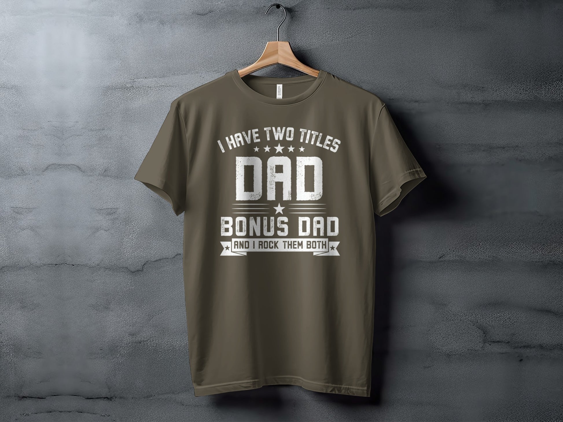 Olive green t-shirt with "I HAVE TWO TITLES DAD BONUS DAD AND I ROCK THEM BOTH" graphic.